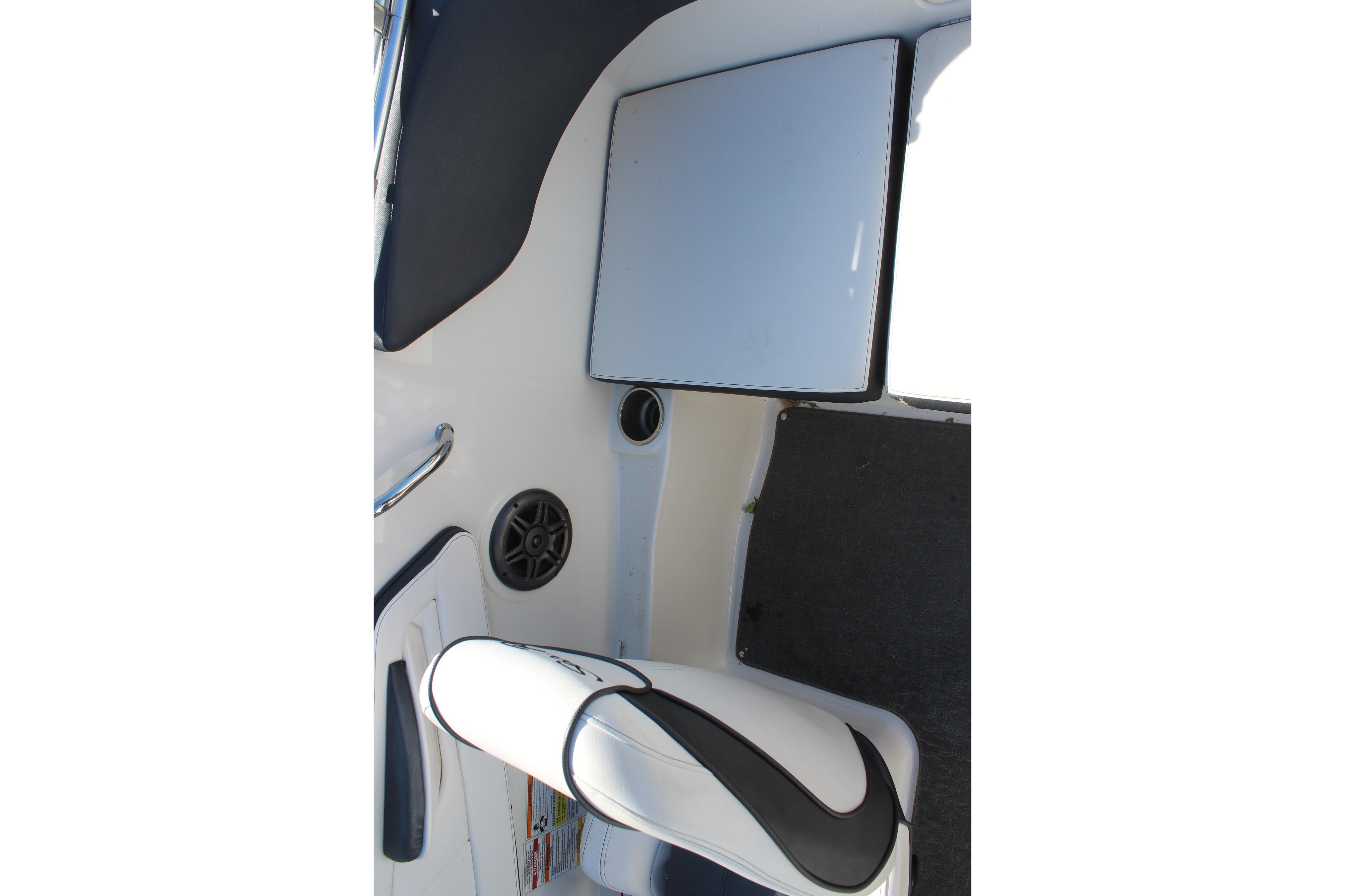 Interior view of a 2015 Sea Ray 19 SPX OB boat, featuring seating and storage.