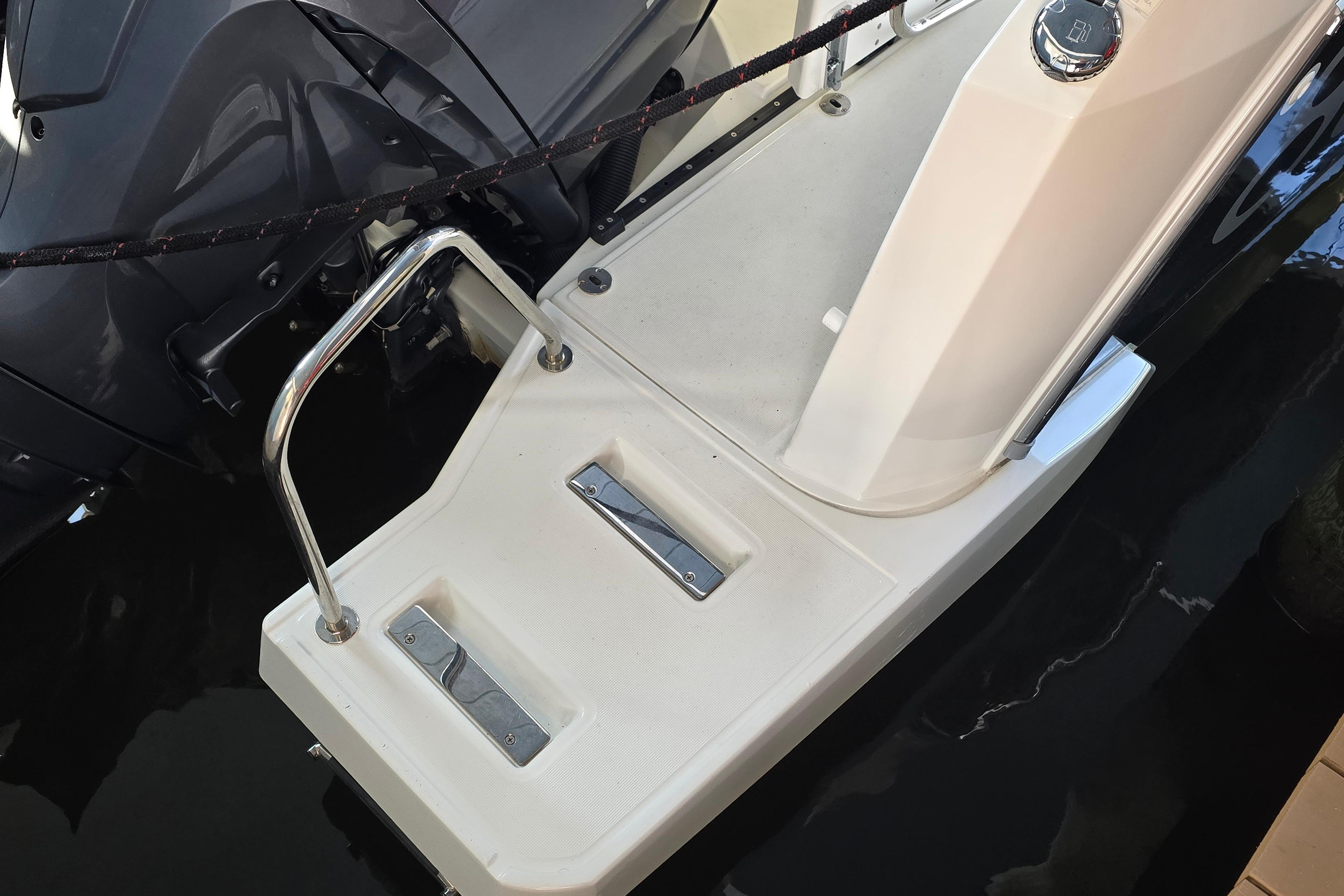 The 2023 Jeanneau NC Sport 895 features a swim platform with stainless steel railing.