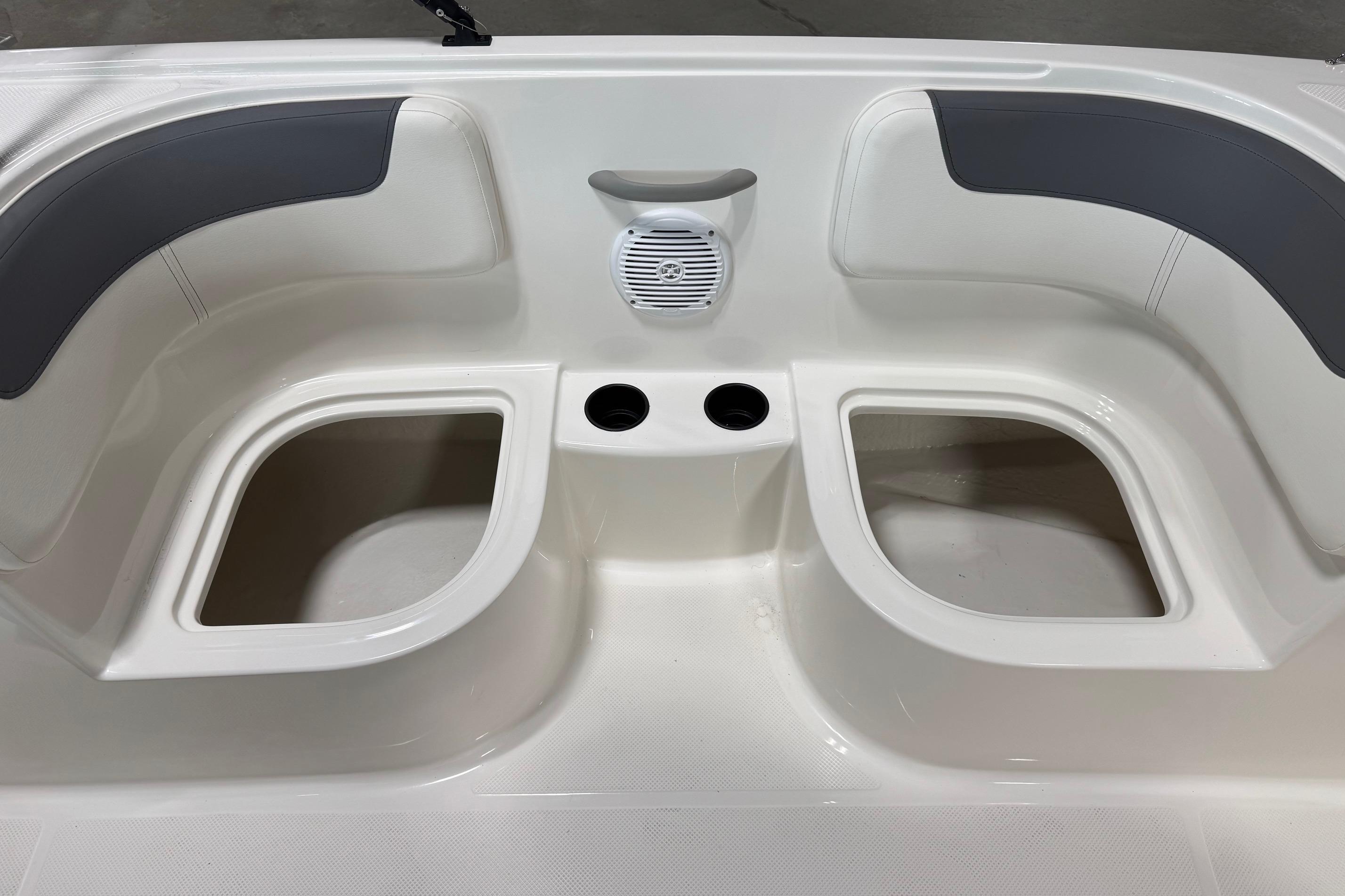 2026 Bayliner Element E18 boat interior with seating, cup holders, and speaker.
