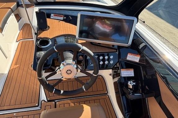 2026 Yamaha Boats 222SE dashboard with steering wheel and touchscreen display.
