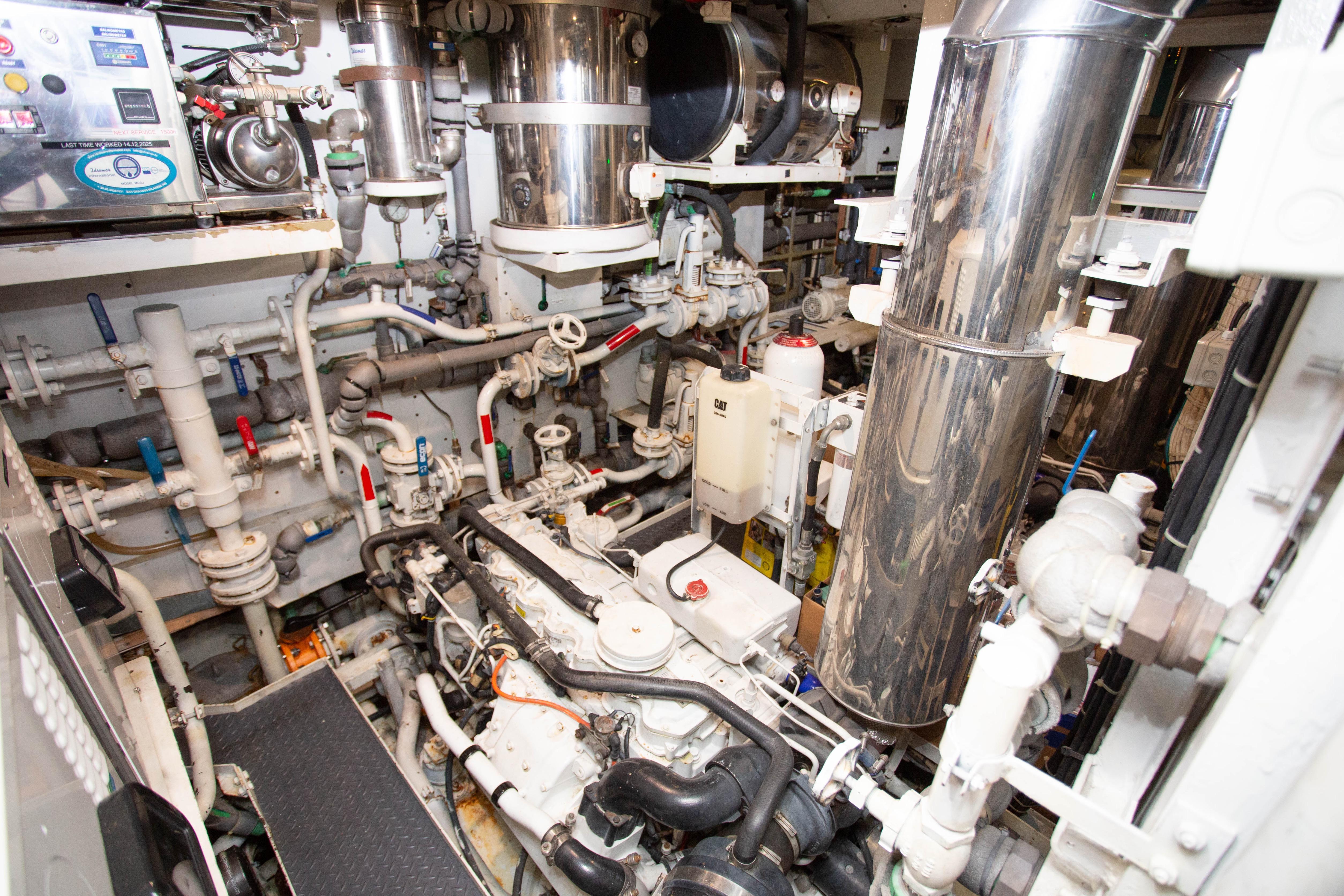 Engine room of 2014 Fifth Ocean Yachts 24m Displacement Explorer Yacht, showcasing complex machinery.