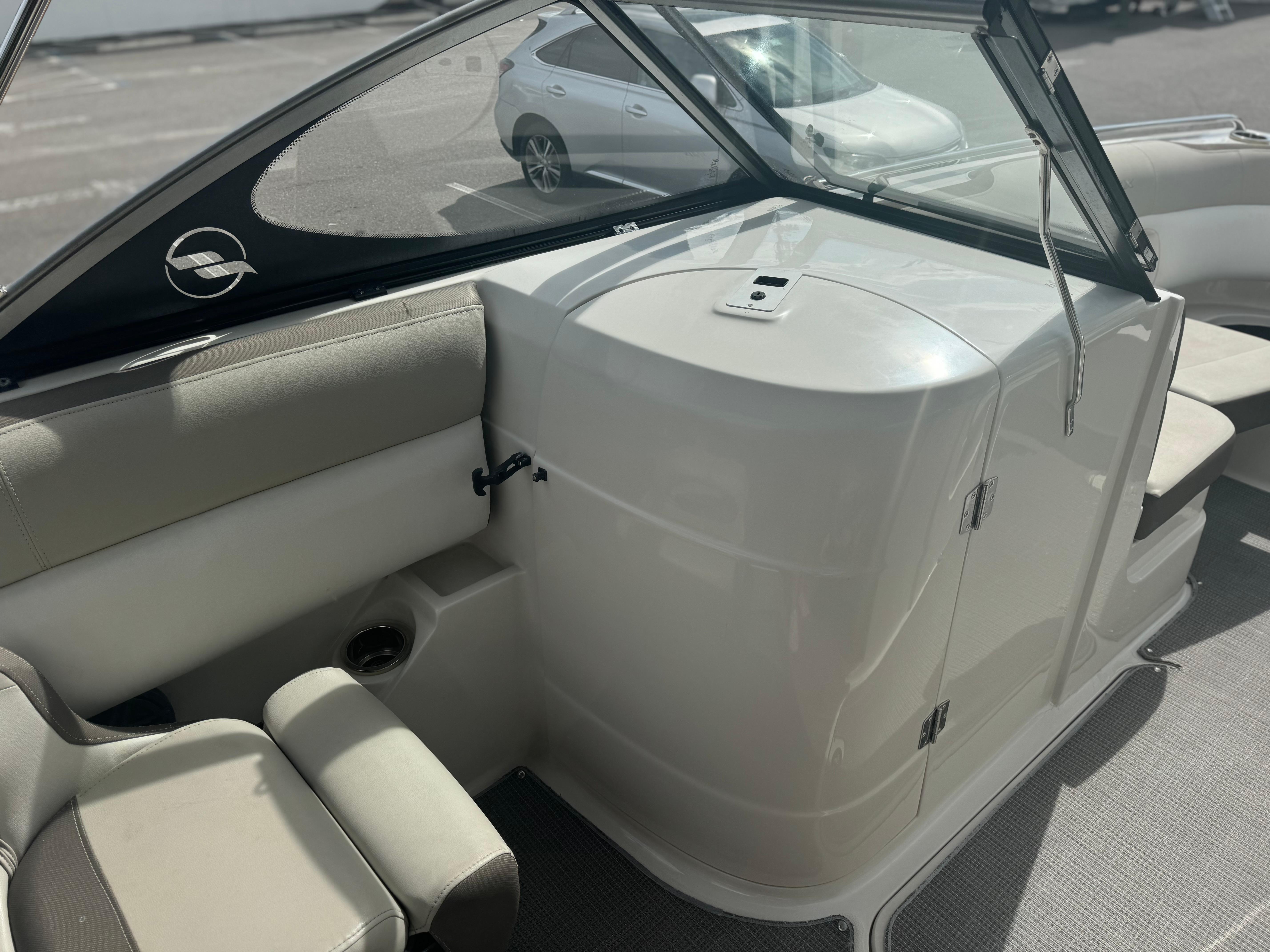 2017 Starcraft 230 OB SCX EXT boat interior with seating and storage compartment.