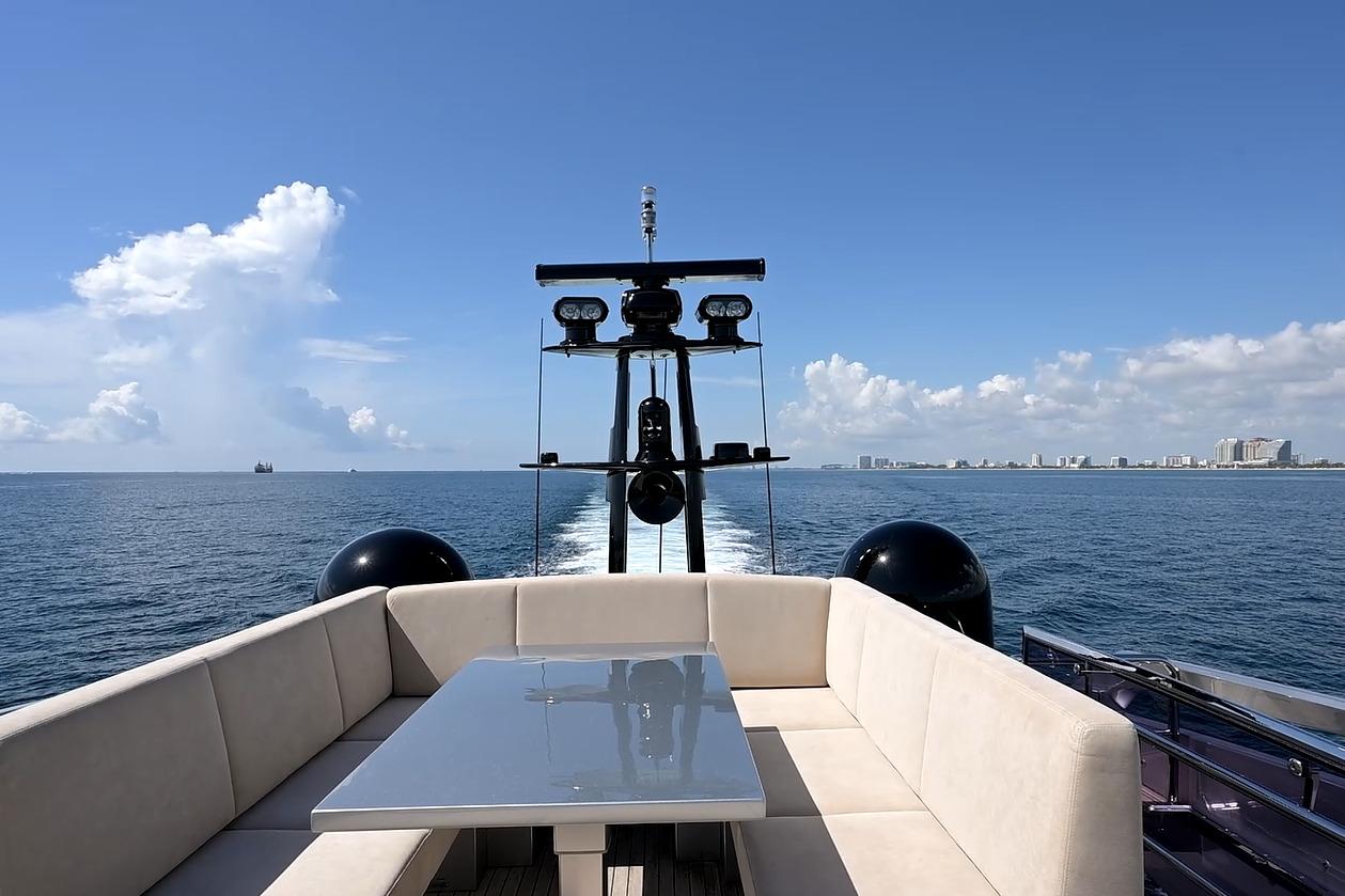 Luxurious 2015 Pershing 92 yacht cruising with elegant seating and ocean view.