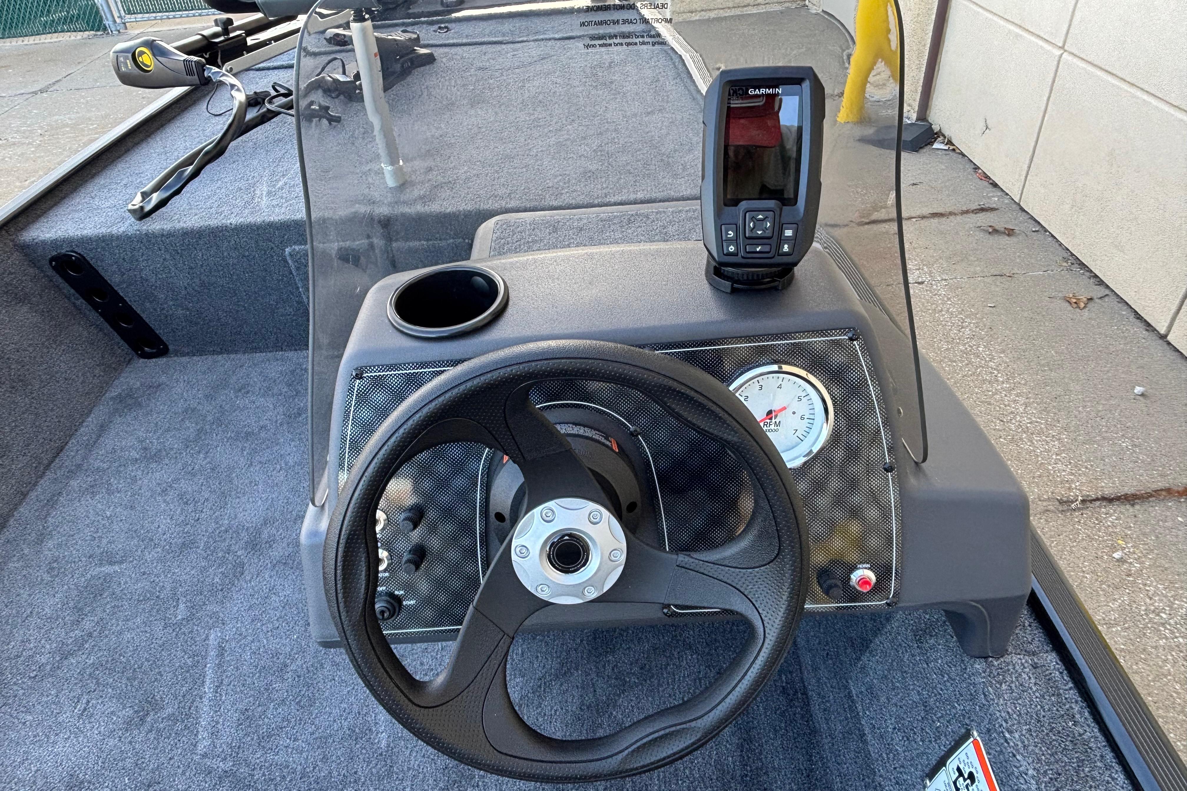 2026 Tracker Bass Tracker Classic XL dashboard with steering wheel and Garmin device.