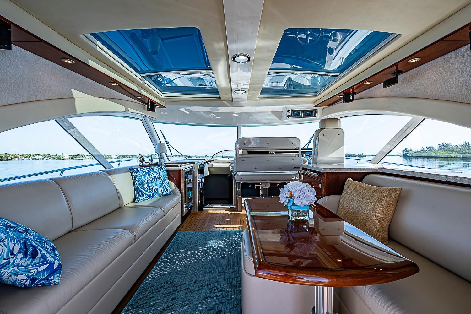 Luxurious interior of 2008 Sea Ray 60 Sundancer yacht with elegant seating and panoramic windows.