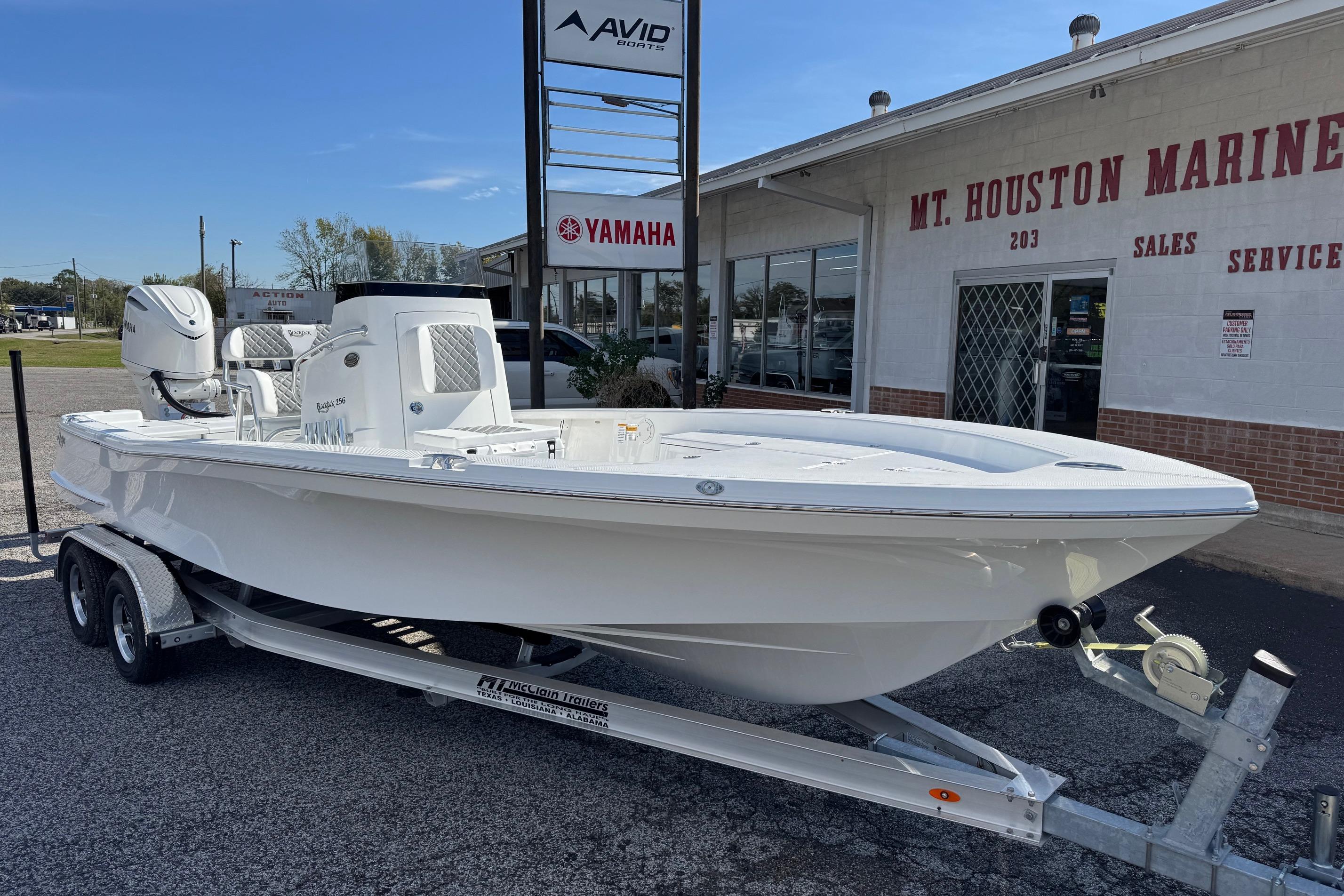 2026 BlackJack 256 Bay boat on trailer at Mt. Houston Marine dealership.