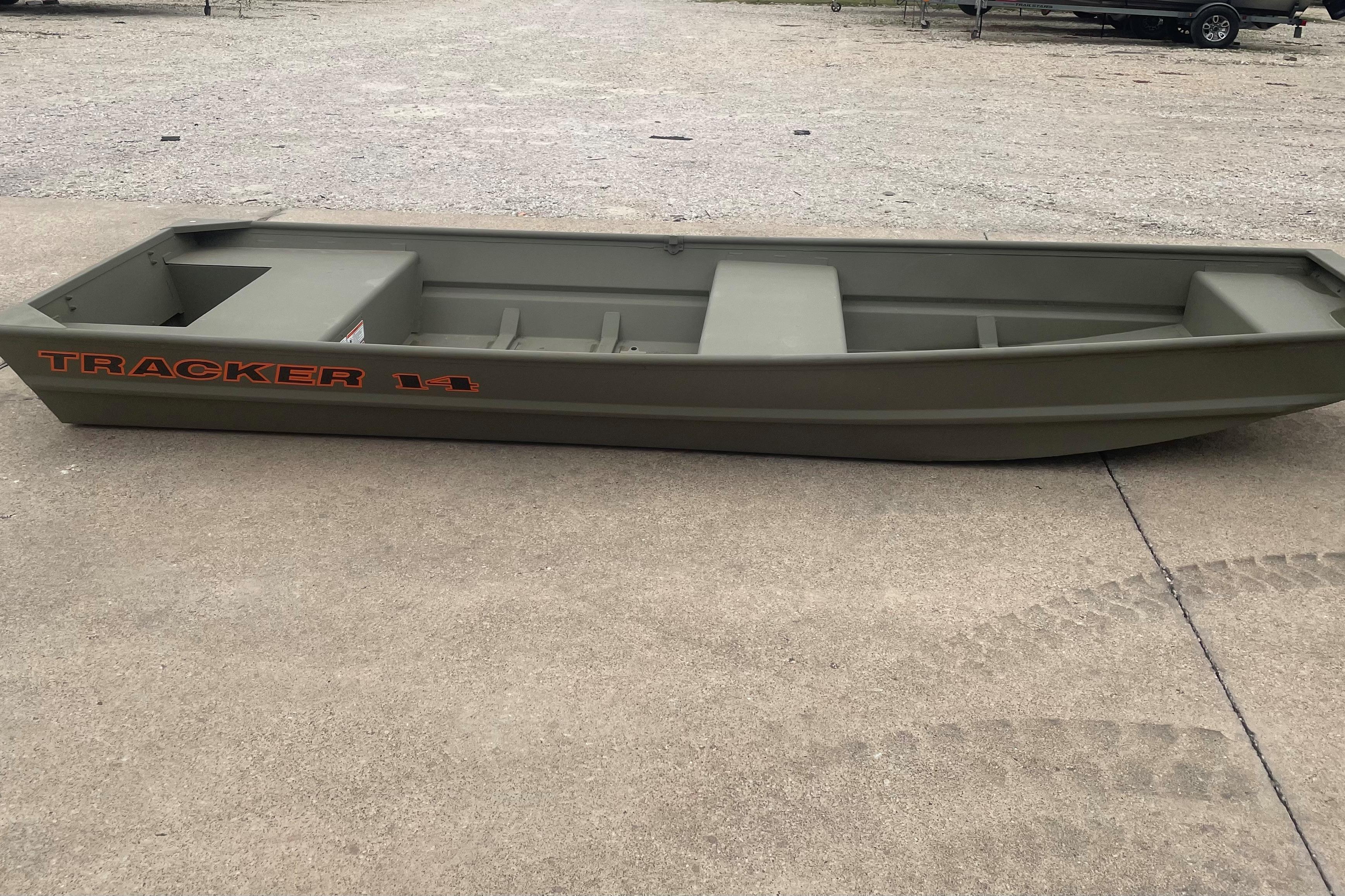 2026 Tracker Grizzly 14 Jon boat on concrete surface, showcasing its sturdy design.