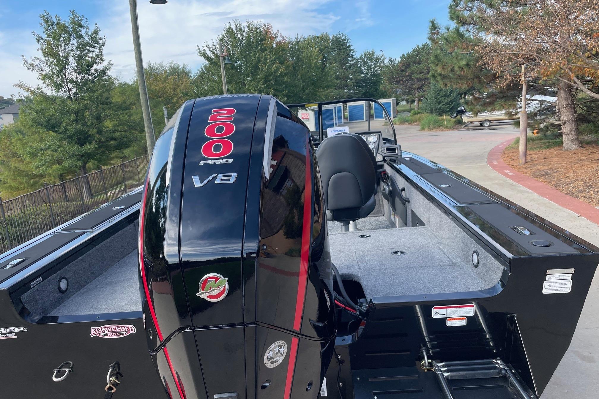 2026 Tracker Targa V-18 WT boat with powerful 200 Pro V8 engine, parked outdoors.