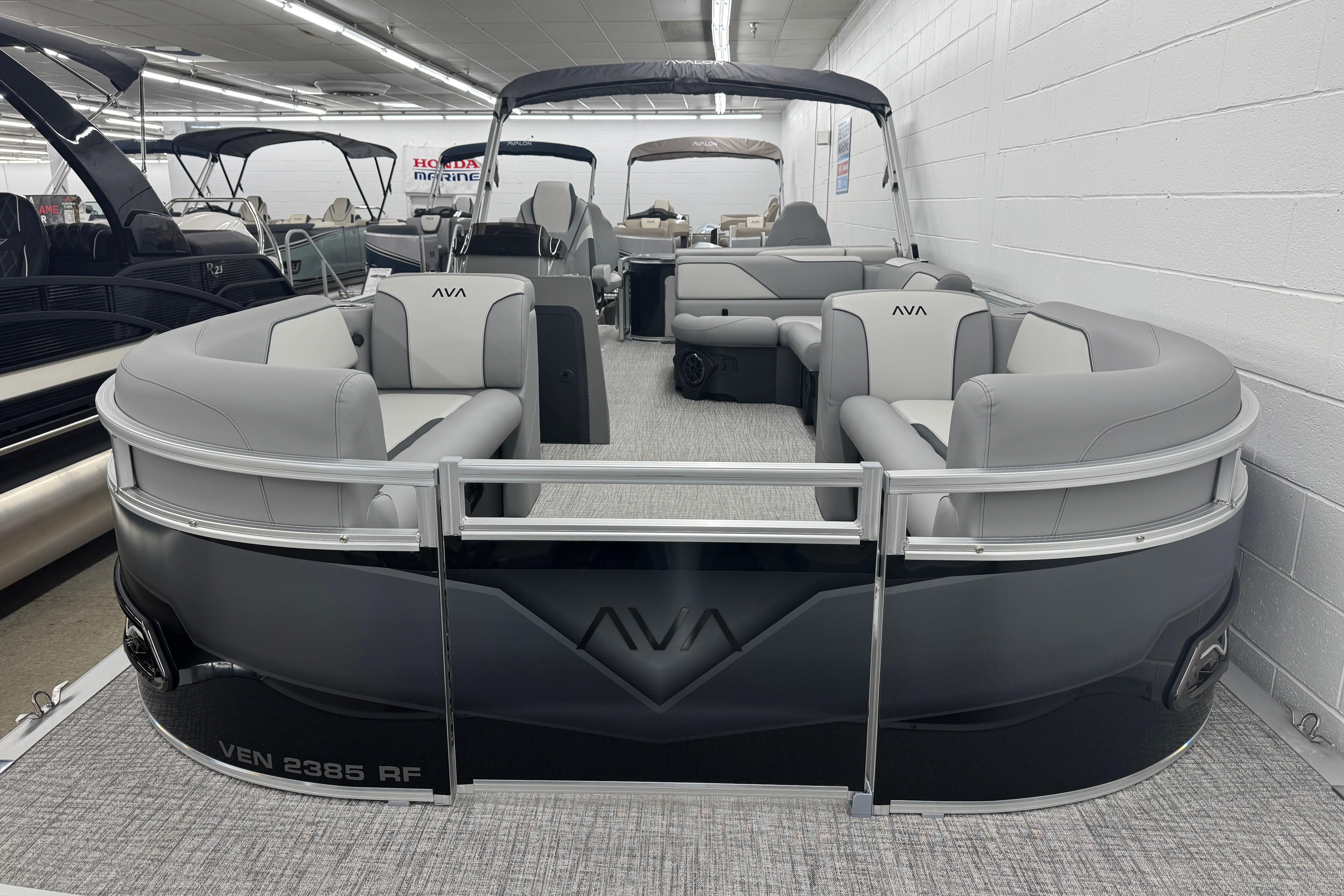 2026 Avalon Ventue 85 RF pontoon boat with sleek design and spacious seating in showroom.