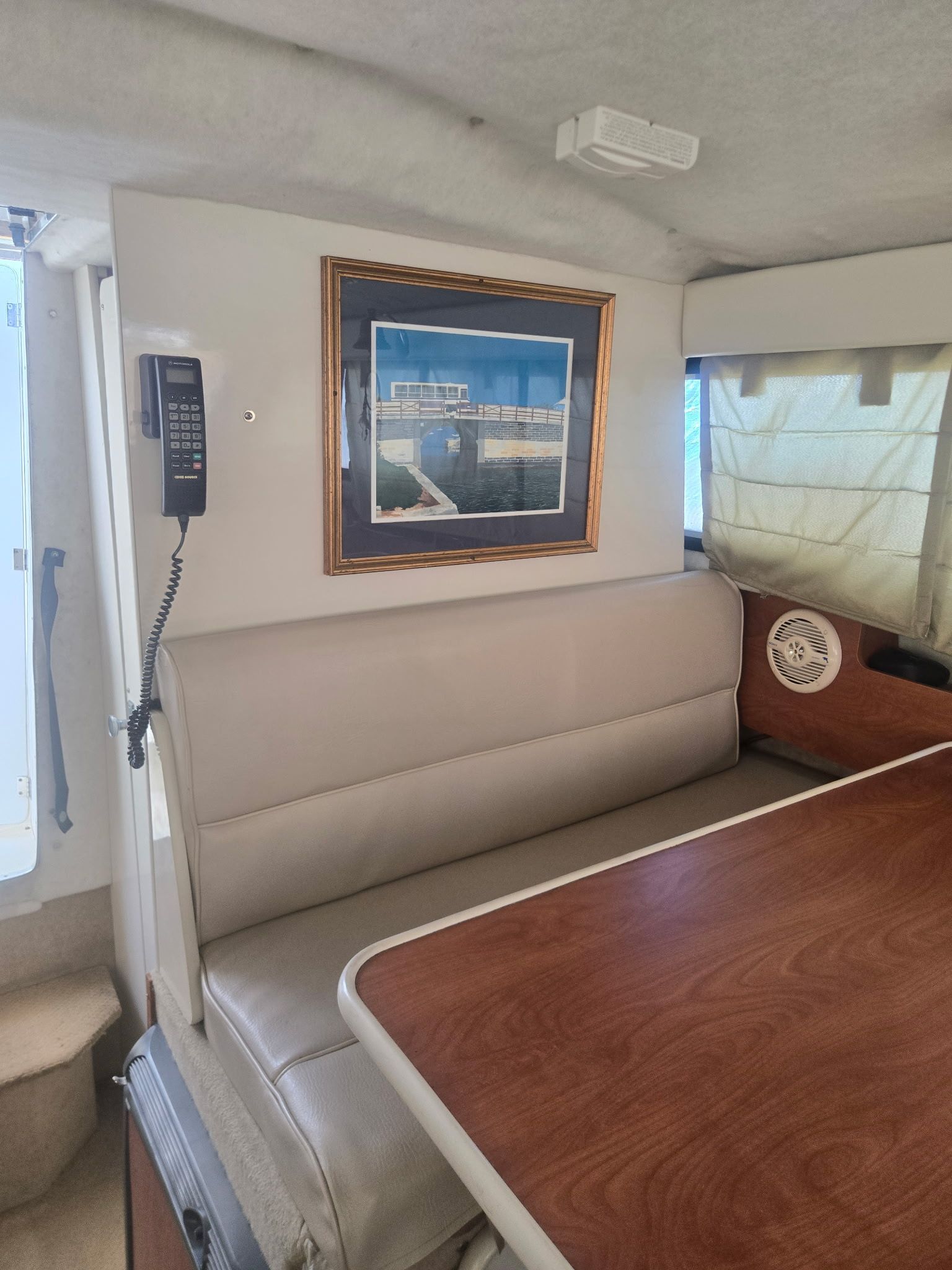 Interior of a 2003 Bayliner 28 yacht with seating and table.