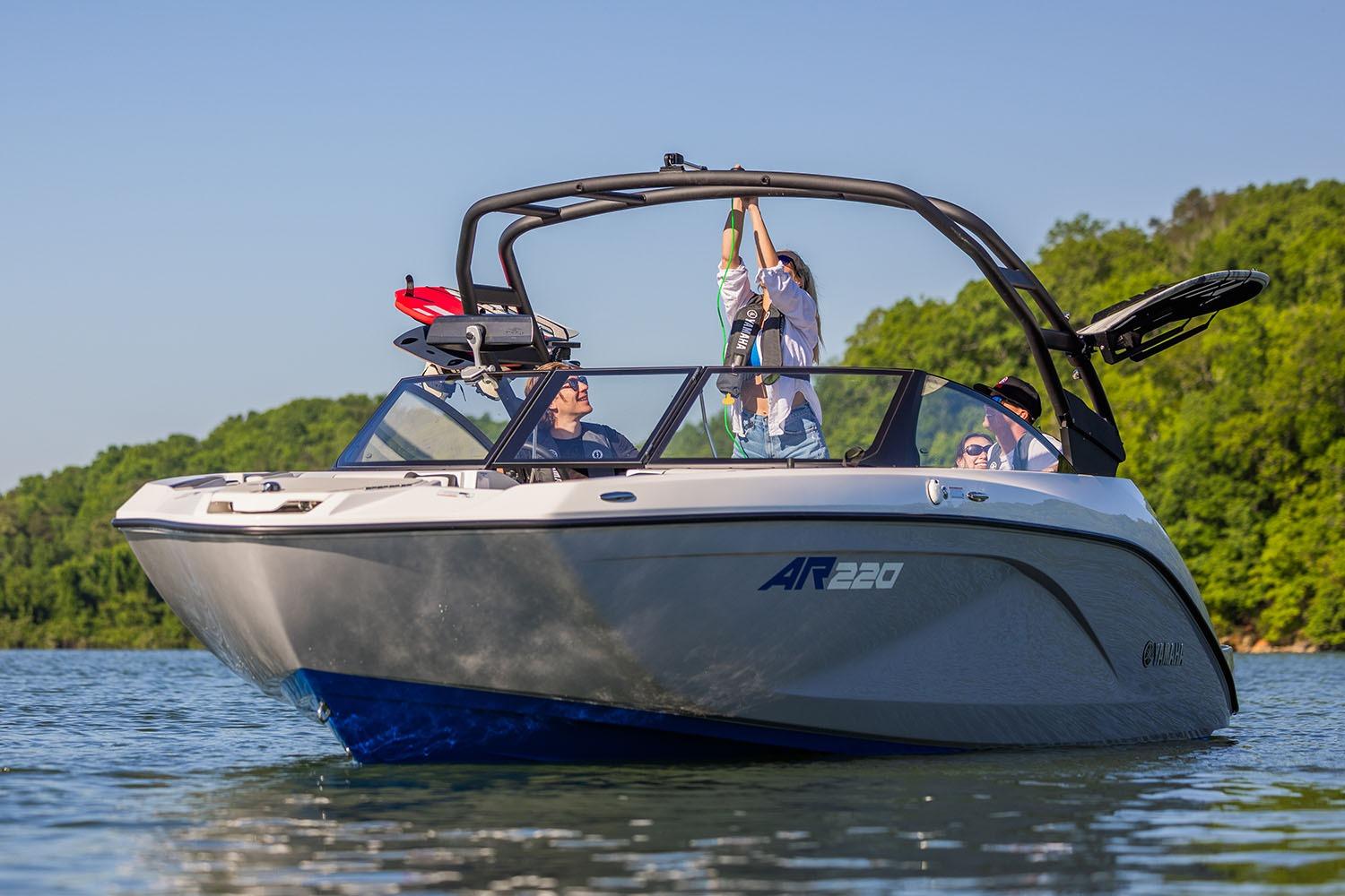 Manufacturer Provided Image: 2026 Yamaha Boats AR220 on a lake, surrounded by lush greenery.