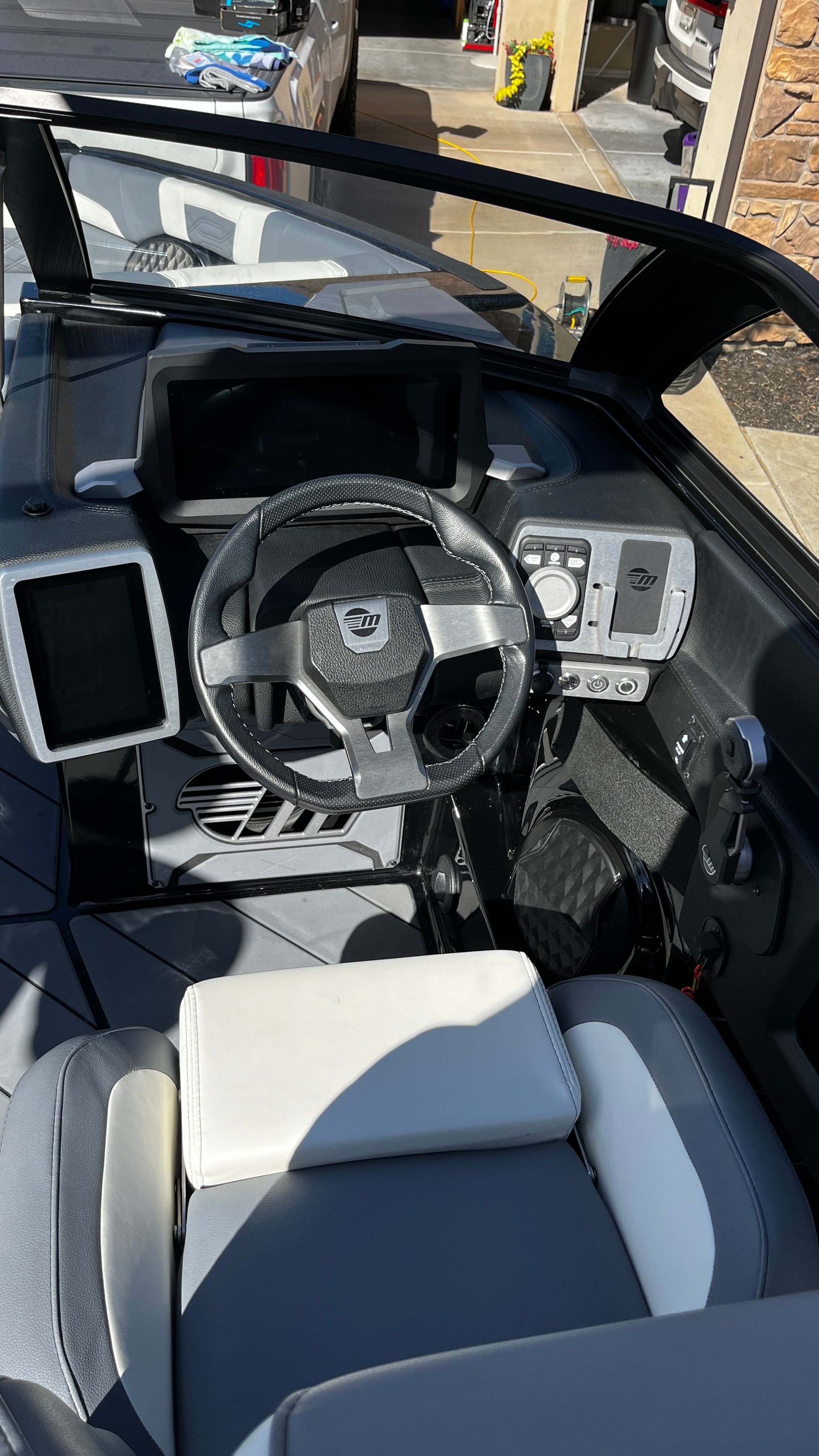 The image shows the cockpit of a 2023 Malibu Wakesetter 26 LSV with modern controls.