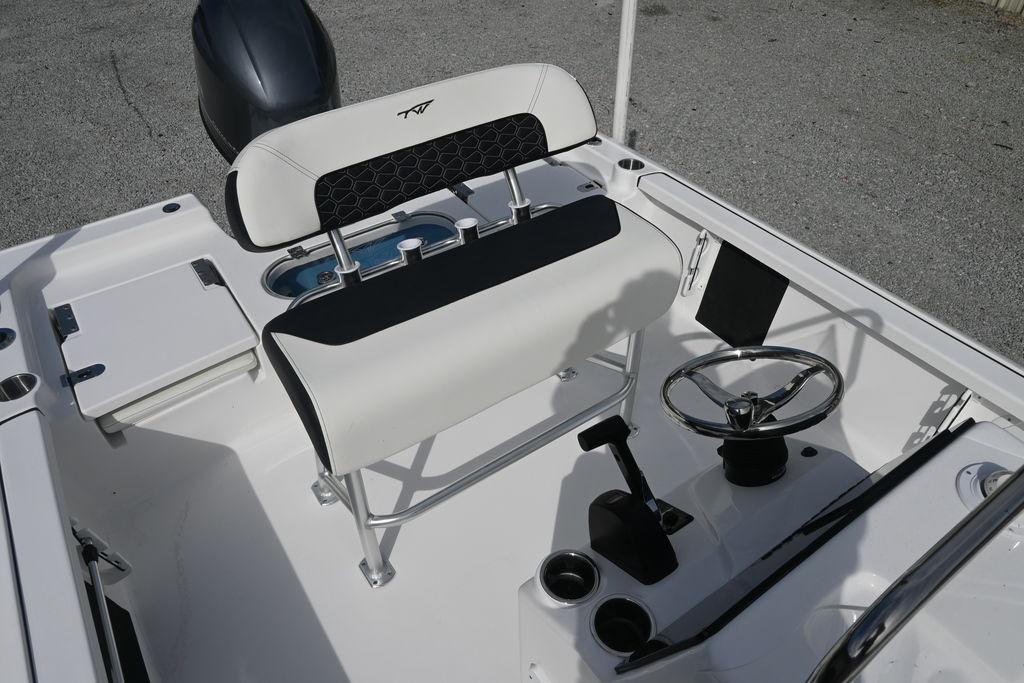 2026 Tidewater 1910 Bay Max boat interior with steering wheel and seating.