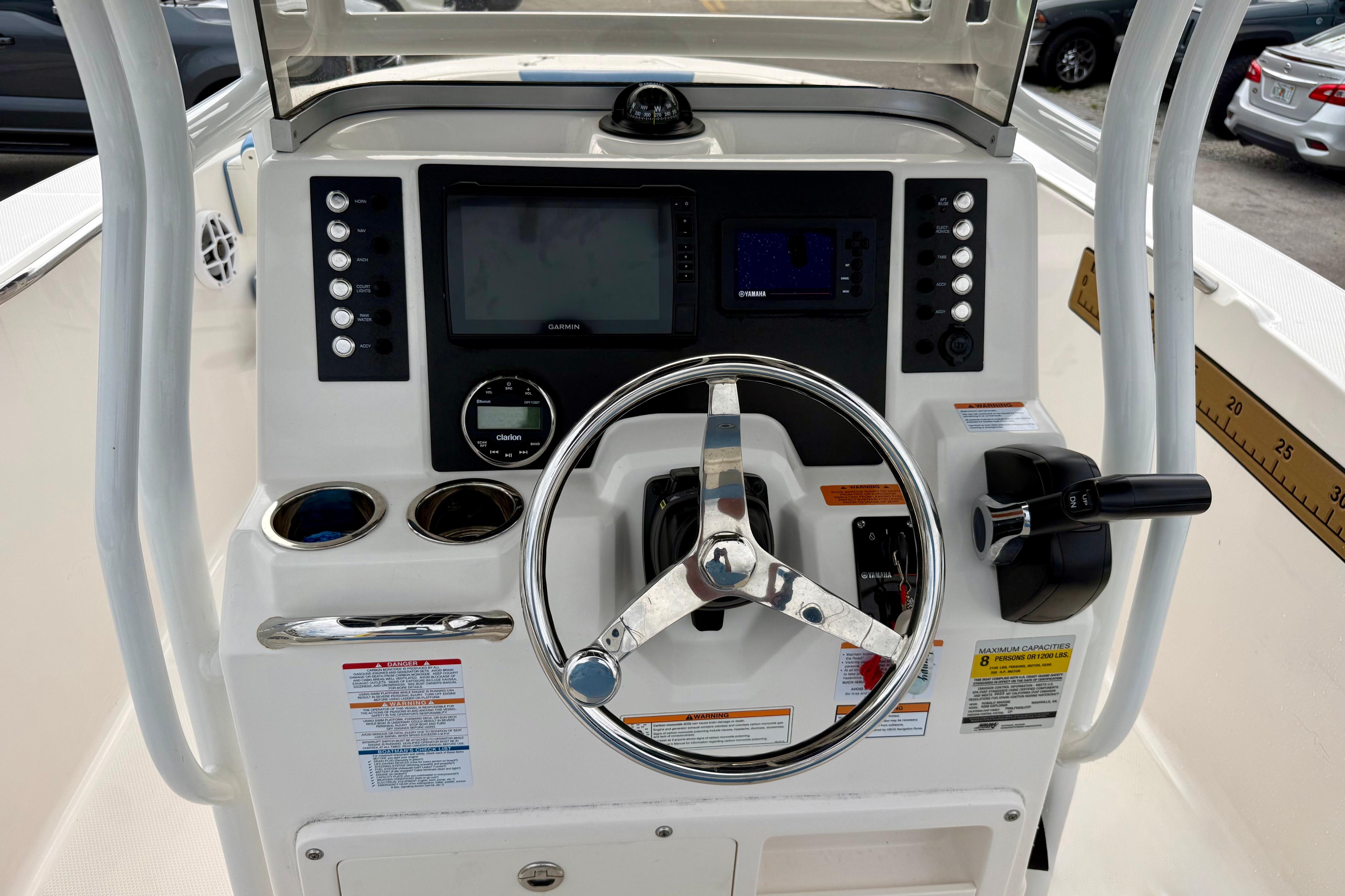 2023 Robalo R202 Explorer boat dashboard with steering wheel and control panel.