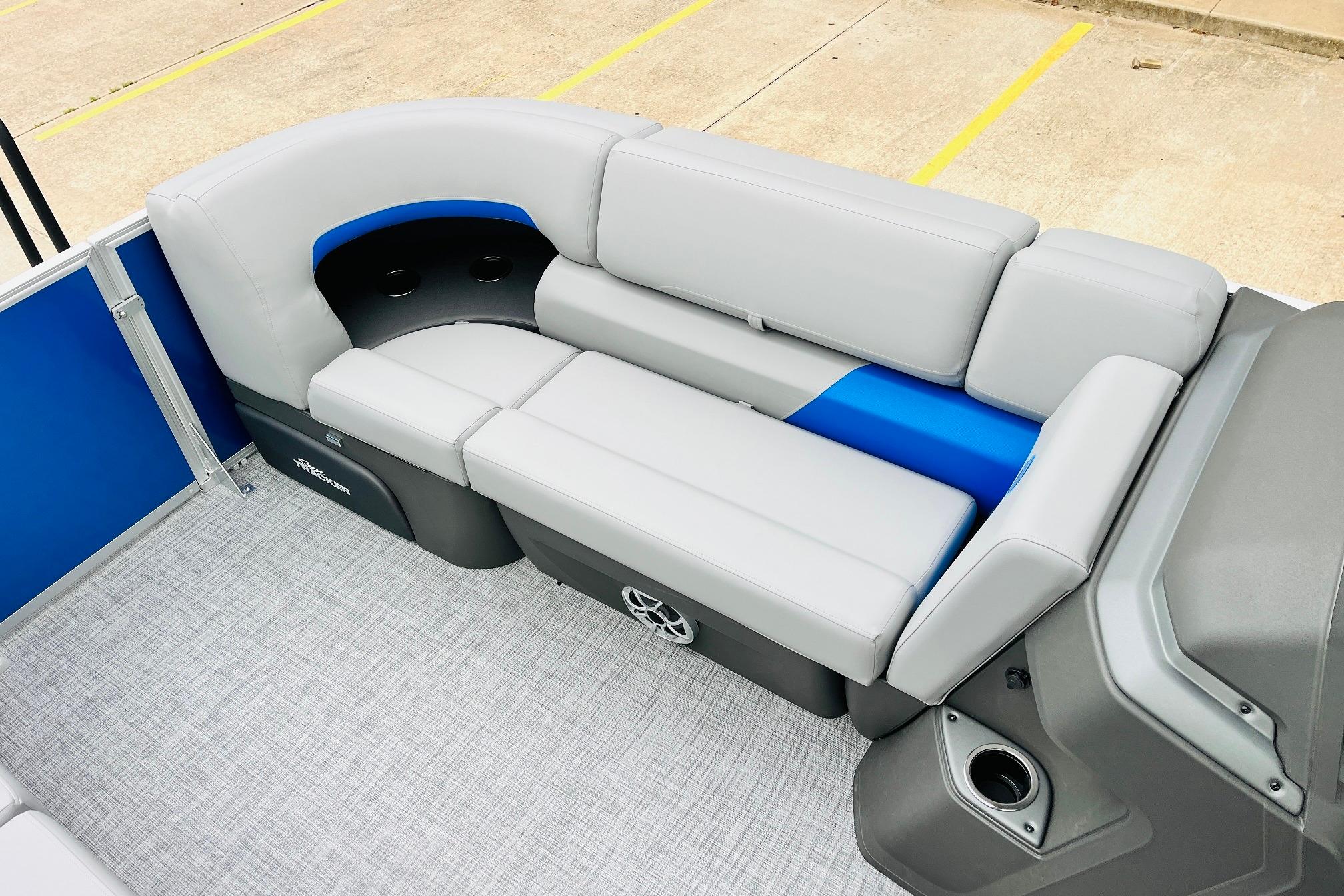 2026 Sun Tracker Party Barge 22 RF DLX interior seating with gray and blue upholstery.