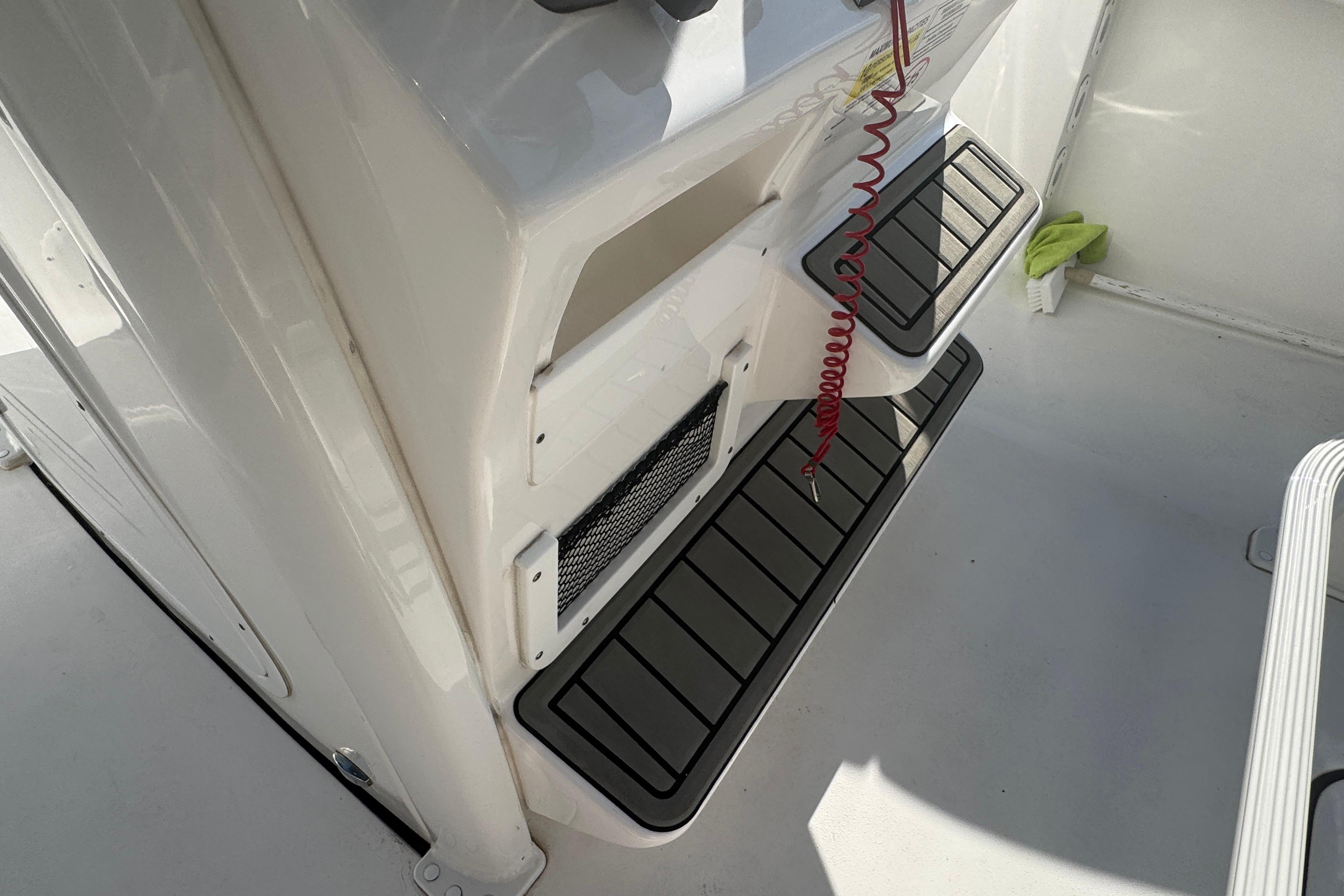 2025 Tidewater 232 LXF boat interior with non-slip flooring and safety features.