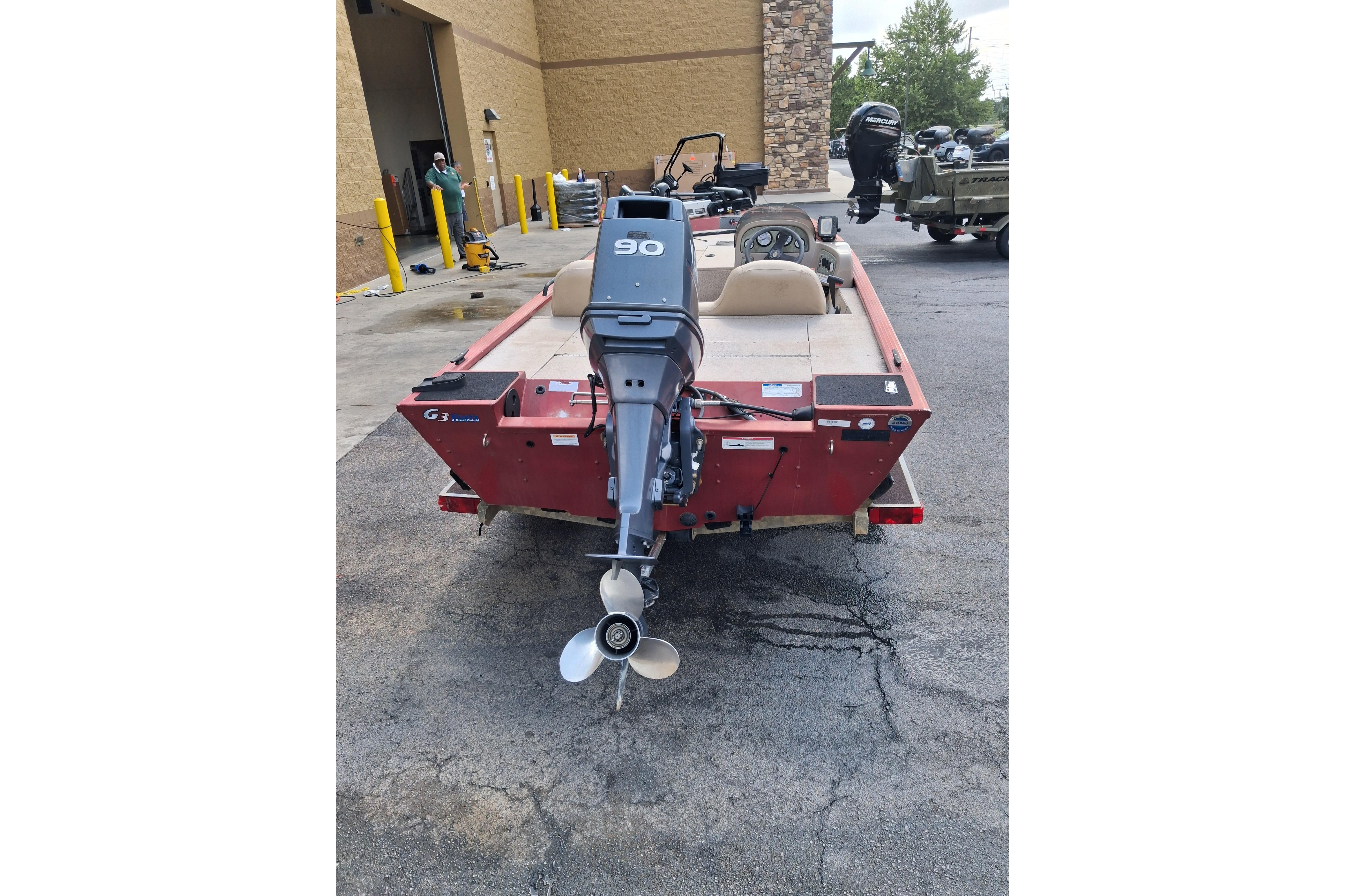 2008 G3 Eagle 175 boat with 90 HP outboard motor in parking lot.
