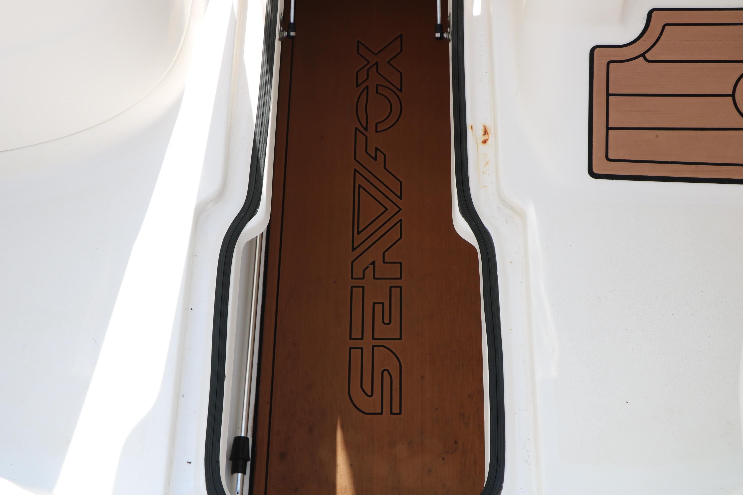 Sea Fox 226 Traveler 2017 boat deck with logo and wood accents.