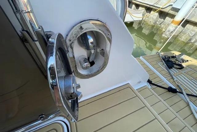 2016 Sea Ray Sundancer 510 yacht deck with chrome fittings and dock view.