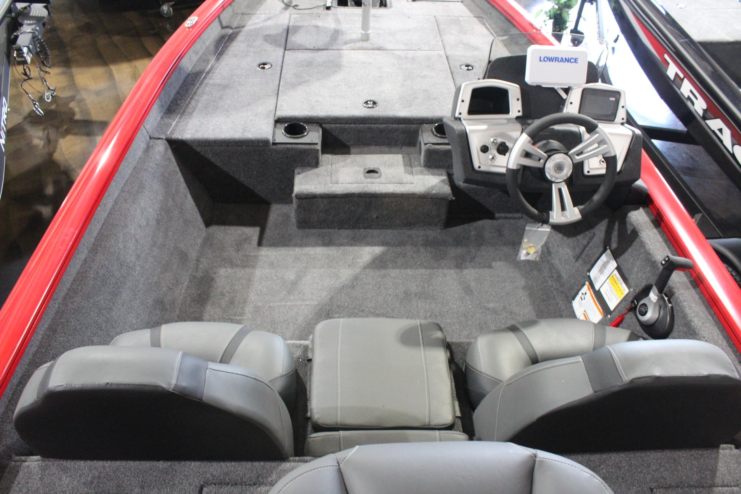 2026 Tracker Pro Team 175 boat interior with steering wheel and seating.