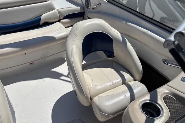 Interior of a 2012 Tahoe Q8 SSi boat with white and blue seating.