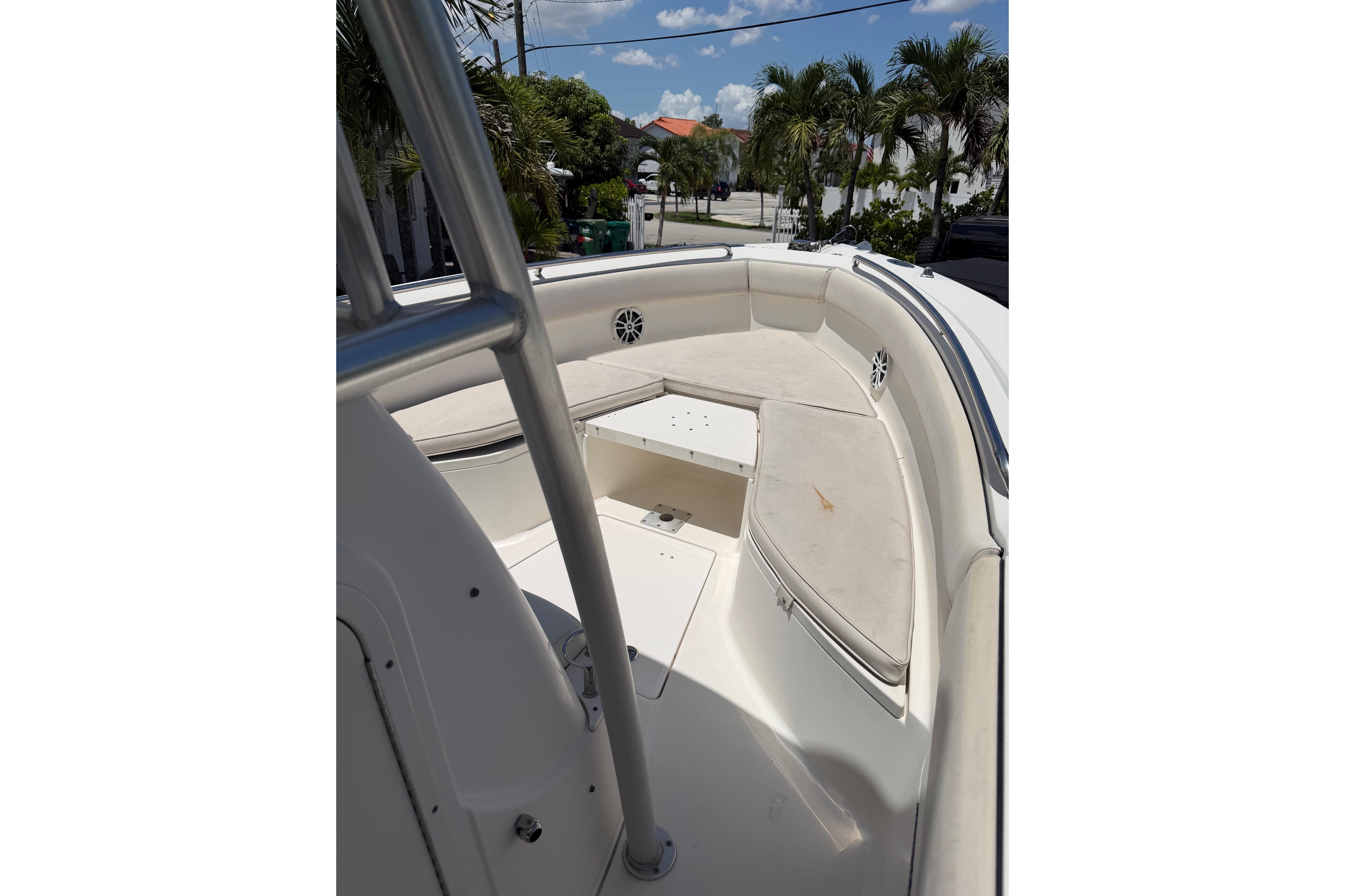 2007 Robalo R260 Center Console boat interior with cushioned seating and storage.