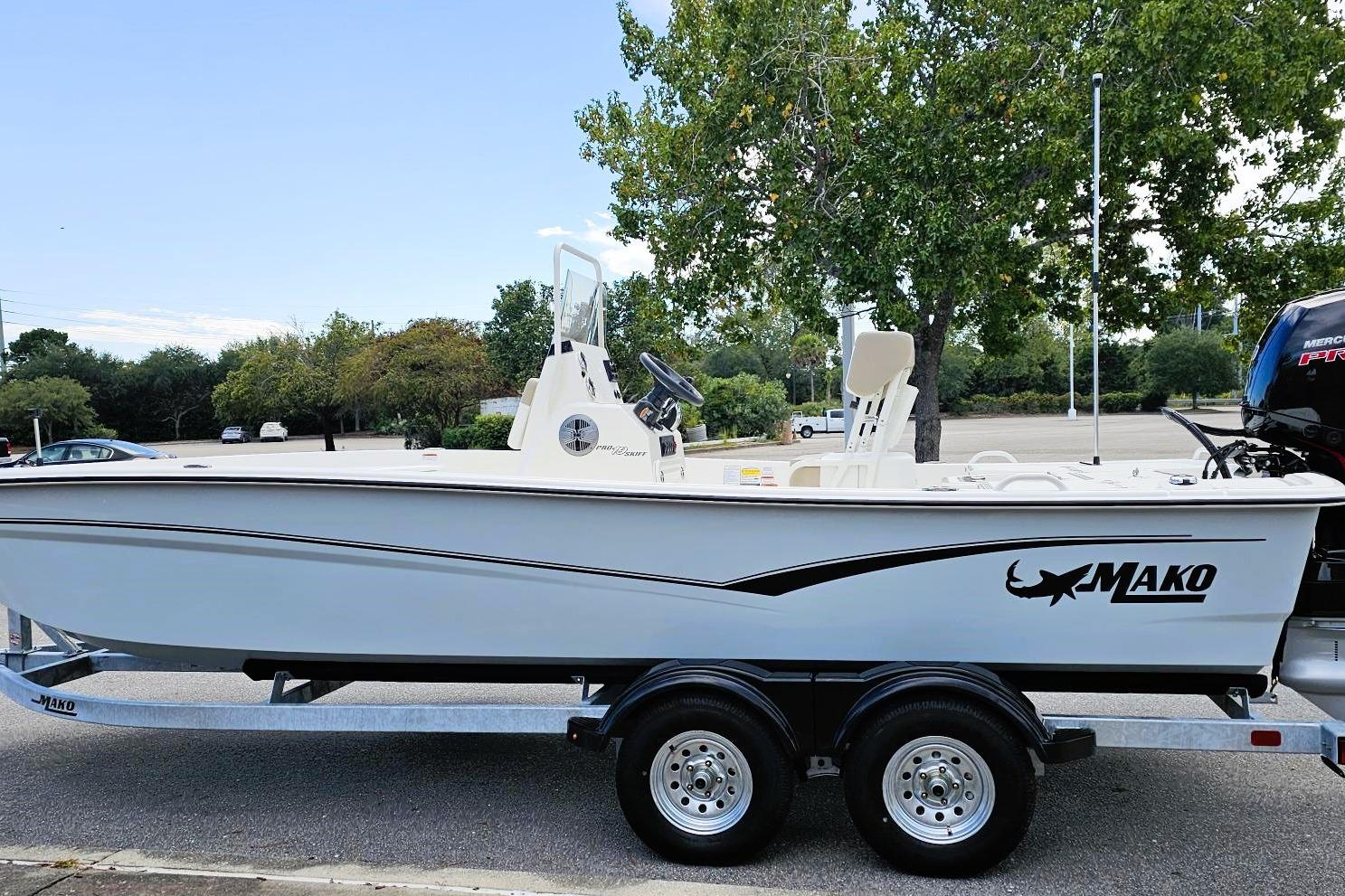 2026 Mako Pro Skiff 19 CC boat on trailer, parked outdoors.