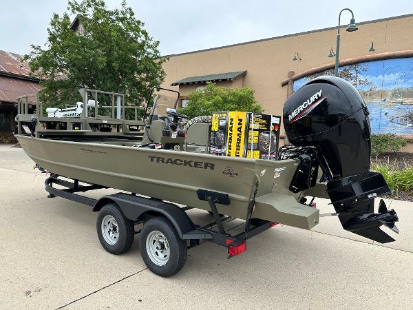 2025 Tracker Grizzly 2072 CC Sportsman boat on trailer with Mercury outboard motor.