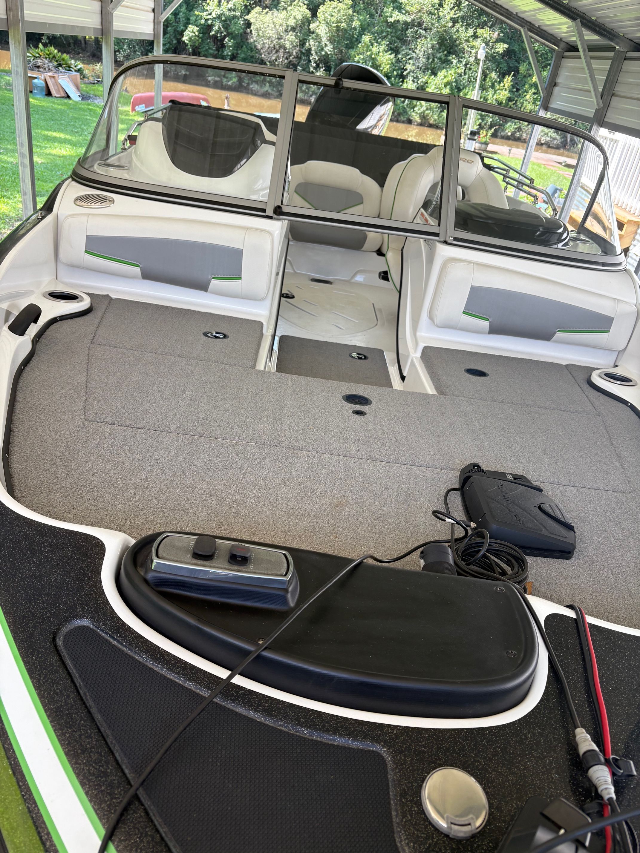 The image shows the deck of a 2021 Nitro Z19 Sport boat with gray carpeting.