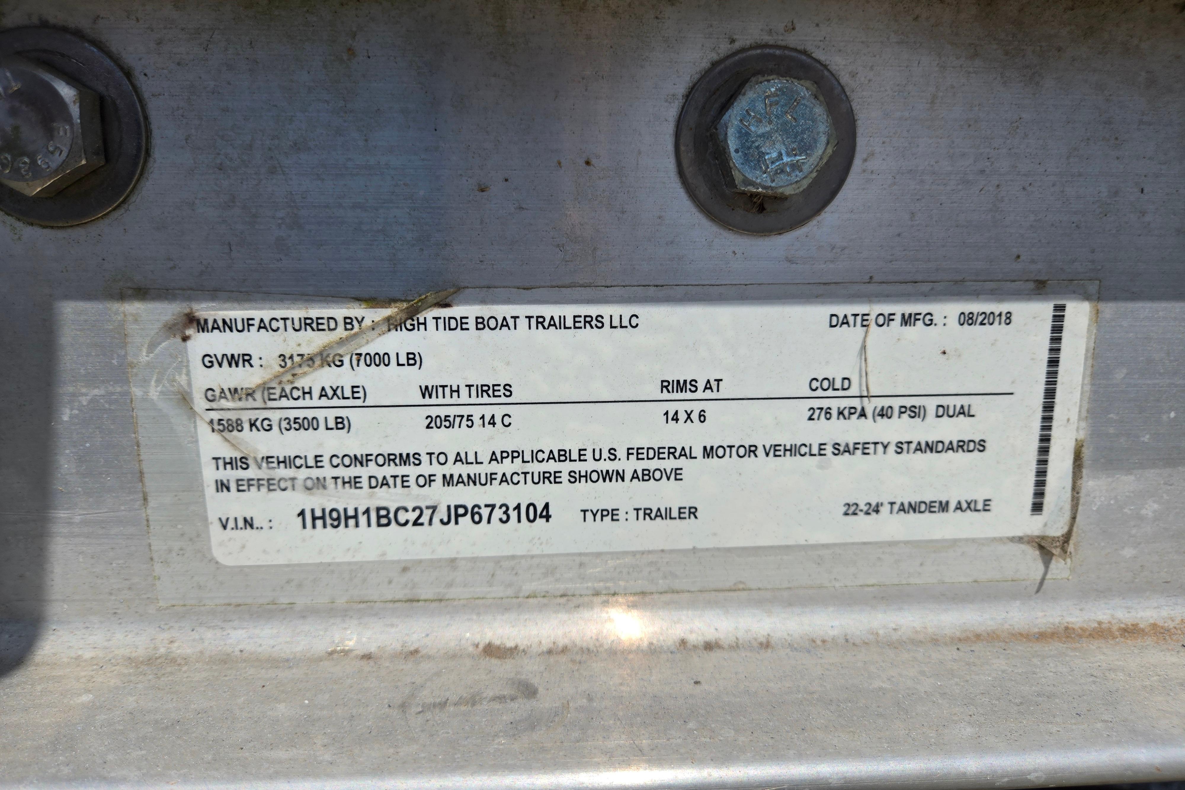Label on a High Tide Boat Trailer, manufactured August 2018, showing specifications and VIN.