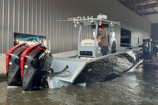 2019 Metal Shark 28 CC boat with dual engines in a marina setting.
