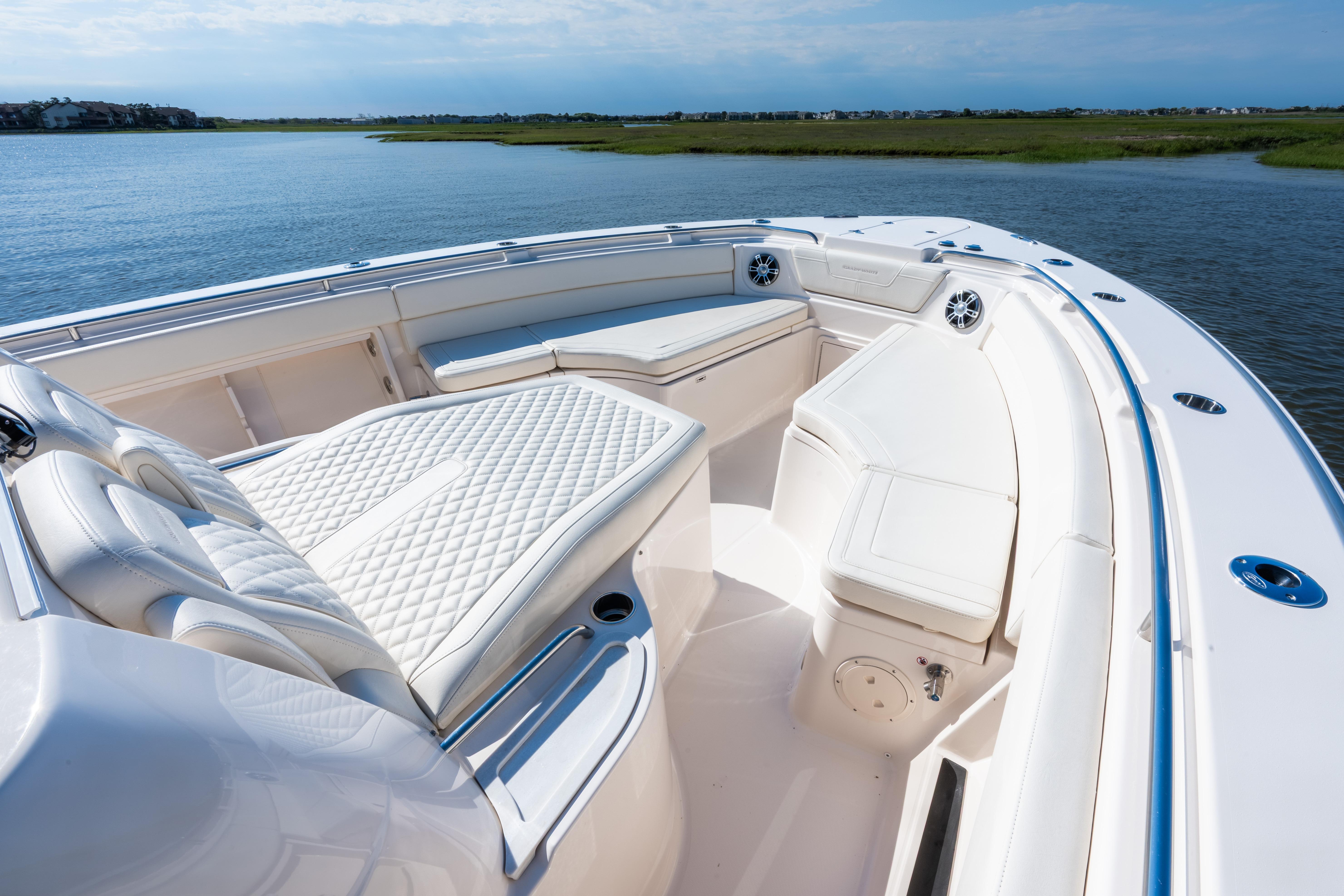 2025 Grady-White Canyon 386 boat interior with luxurious seating on calm water.