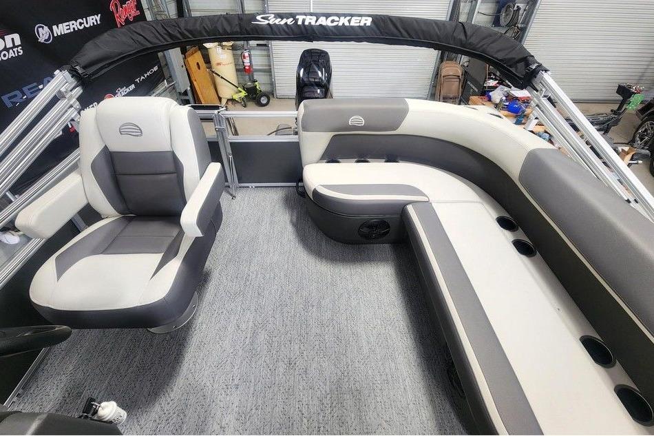 2026 Sun Tracker Bass Buggy 16 DLX interior with gray seating and spacious layout.
