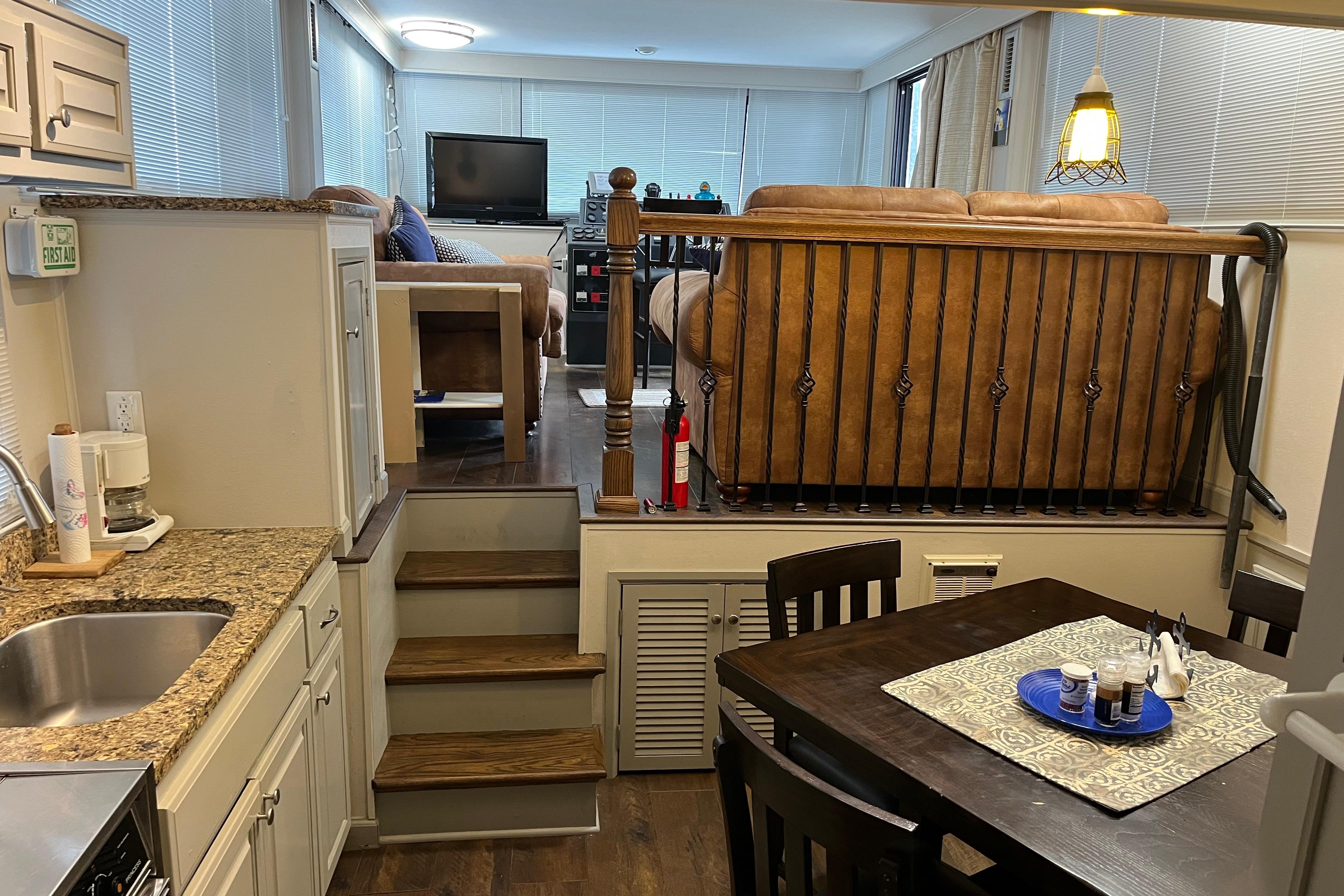 Interior of 1995 WaveLenth Wide Body RV with kitchen and living area.