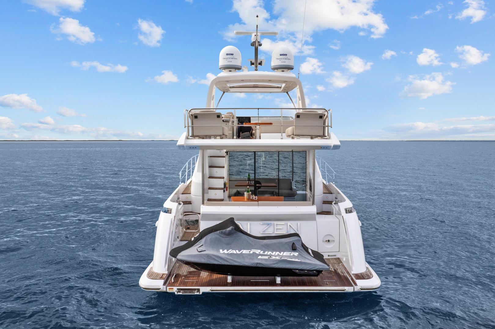 2019 Azimut 55 yacht on open water with WaveRunner on deck.
