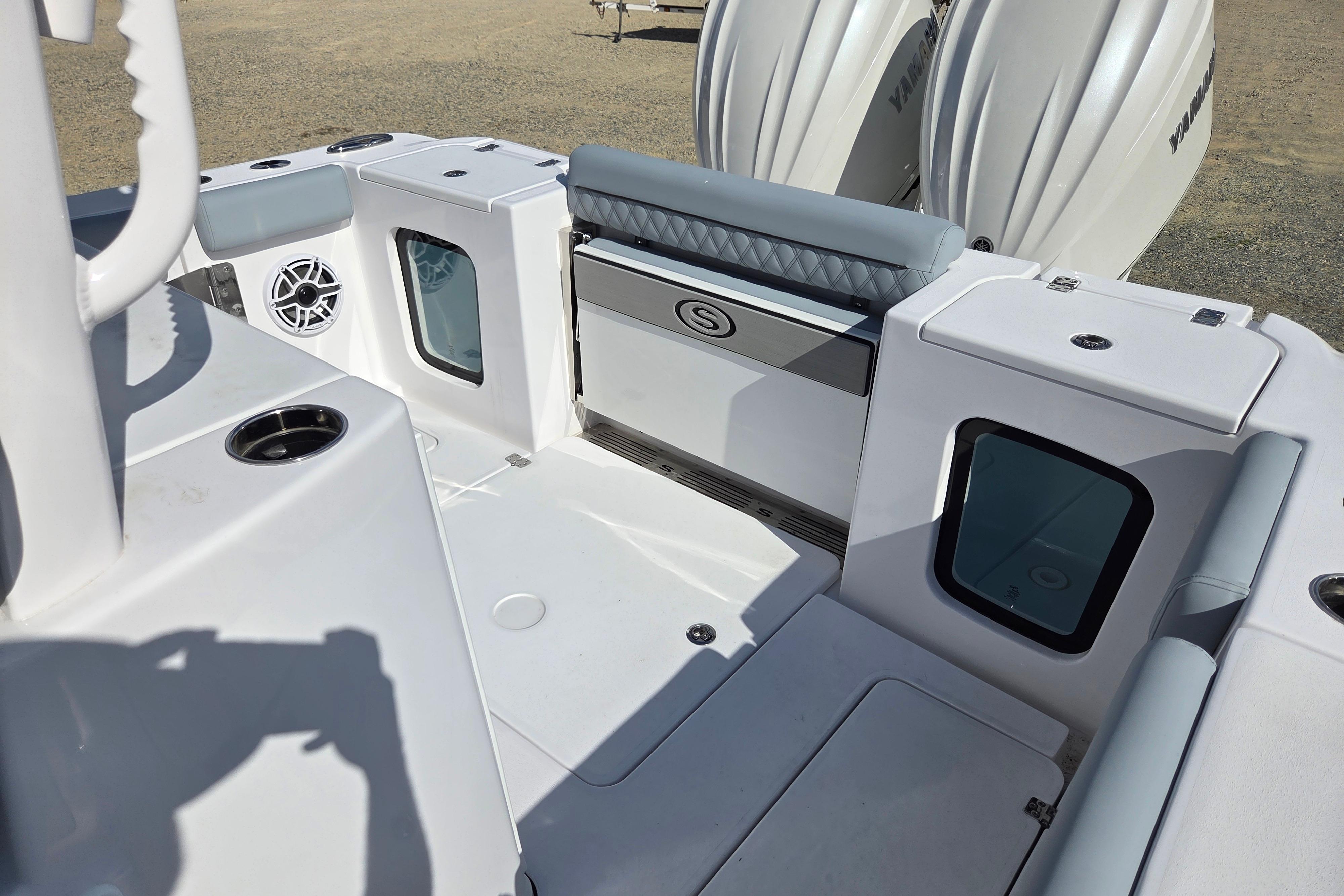 2026 Sportsman Open 282 Center Console boat interior with seating and storage compartments.