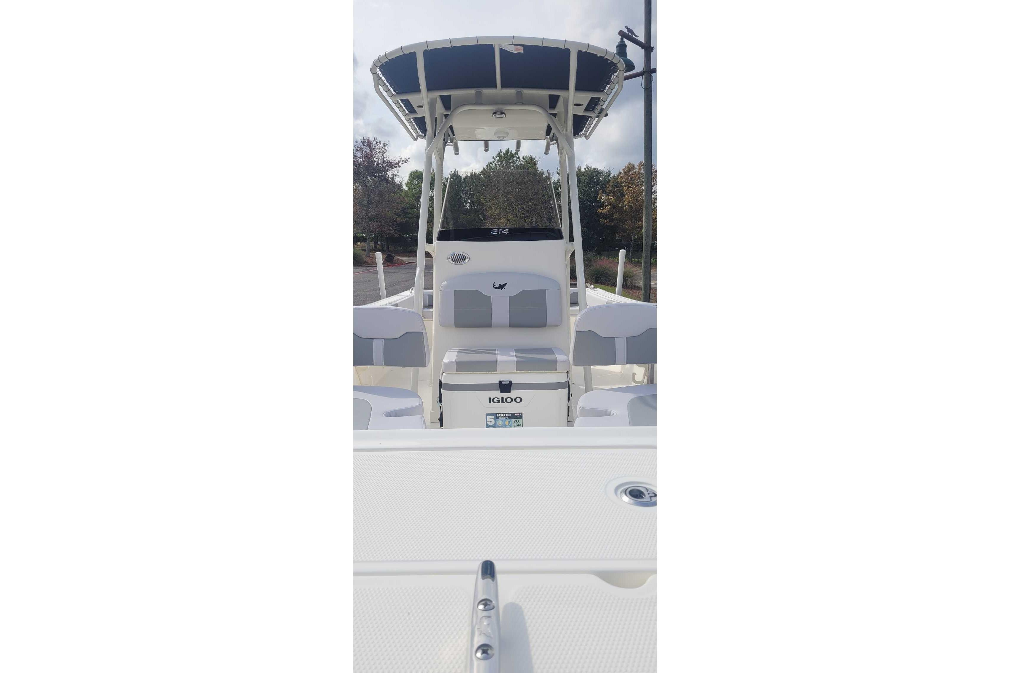 2026 Mako 214 Center Console boat with seating and Igloo cooler.