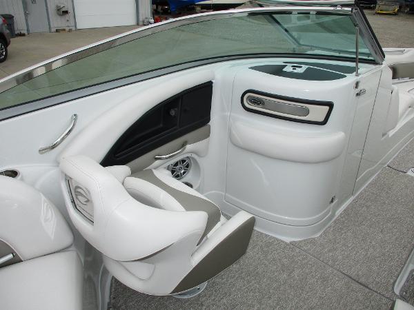 Interior of a 2015 Crownline 285 SS boat, featuring white seats and dashboard.
