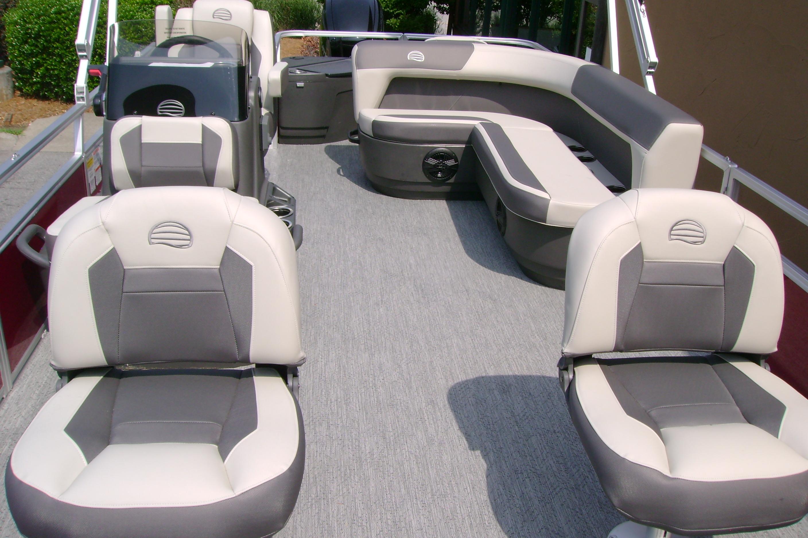 2026 Sun Tracker Bass Buggy 18 DLX pontoon boat interior with cushioned seating.