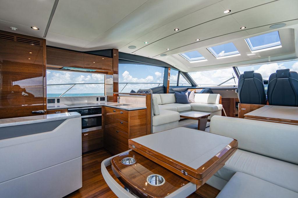 Luxurious interior of 2021 Princess S62 yacht with modern furnishings and panoramic windows.