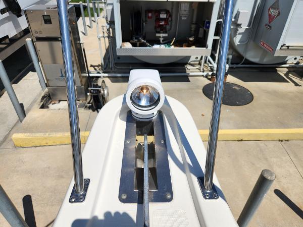 2005 Pursuit 3070 Offshore Center Console spotlight and railing detail at dock.