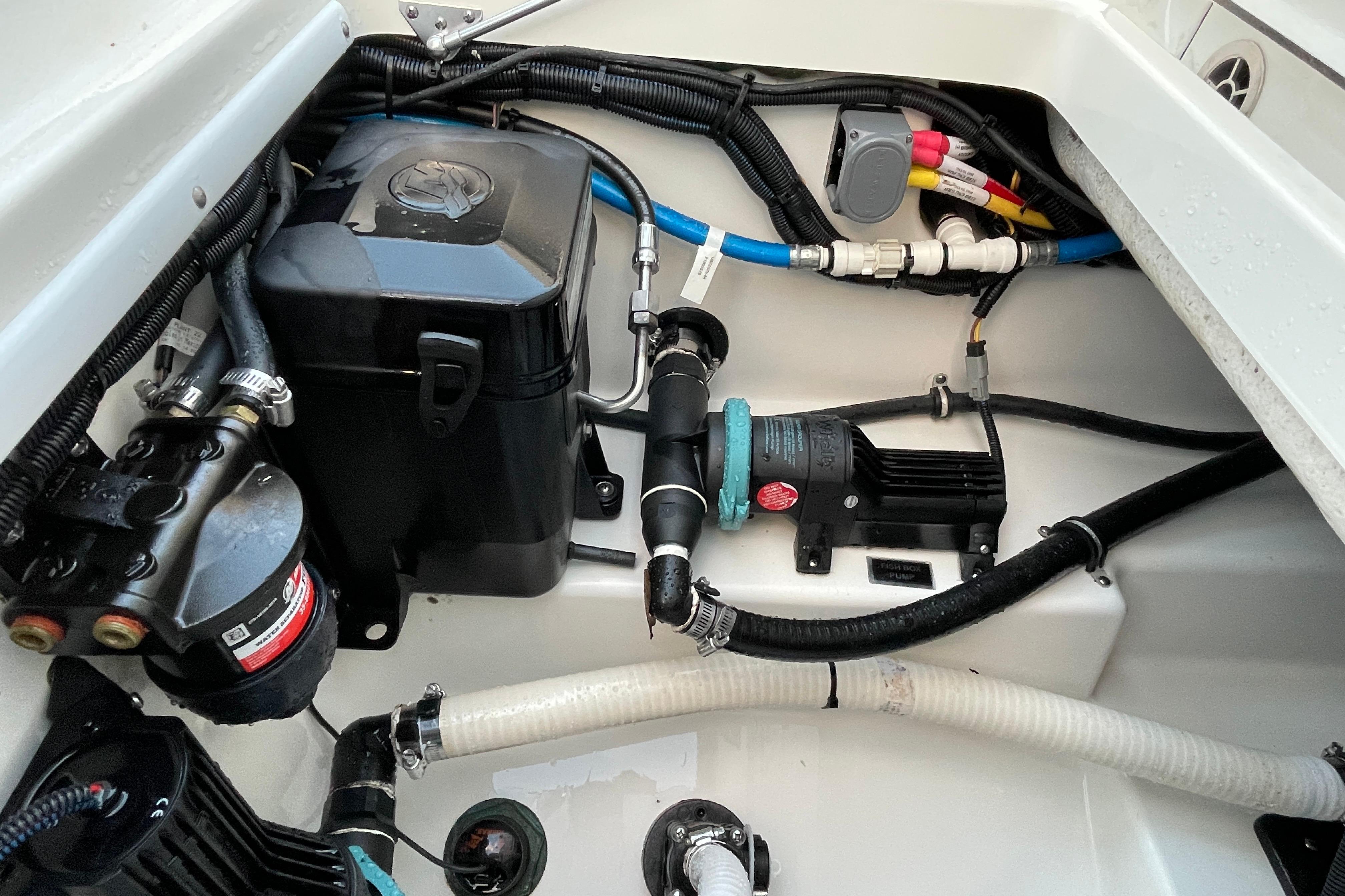 2022 Blackfin 252 CC boat engine compartment with wiring and components.