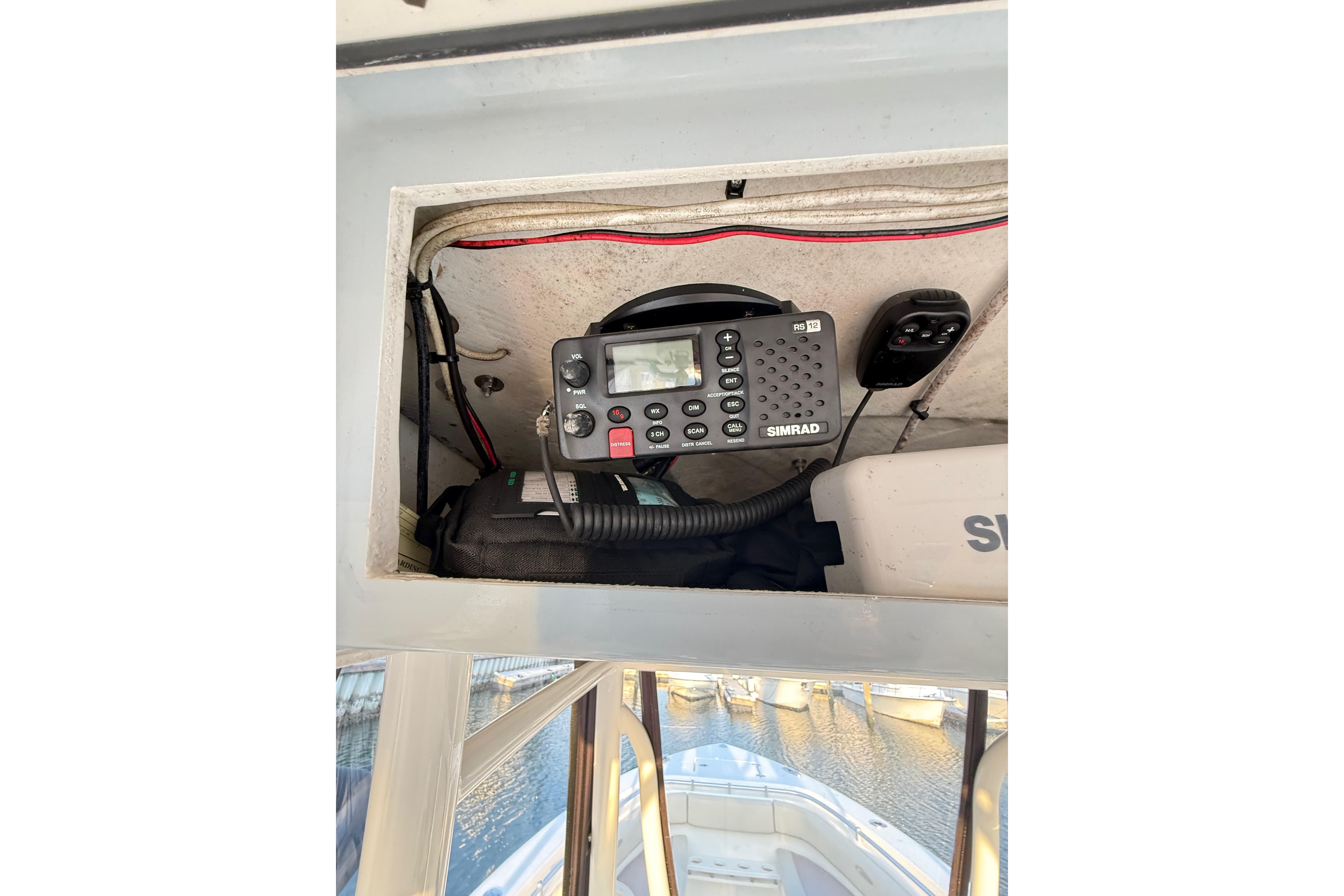 2016 Cobia 296 Center Console with Simrad marine radio equipment.