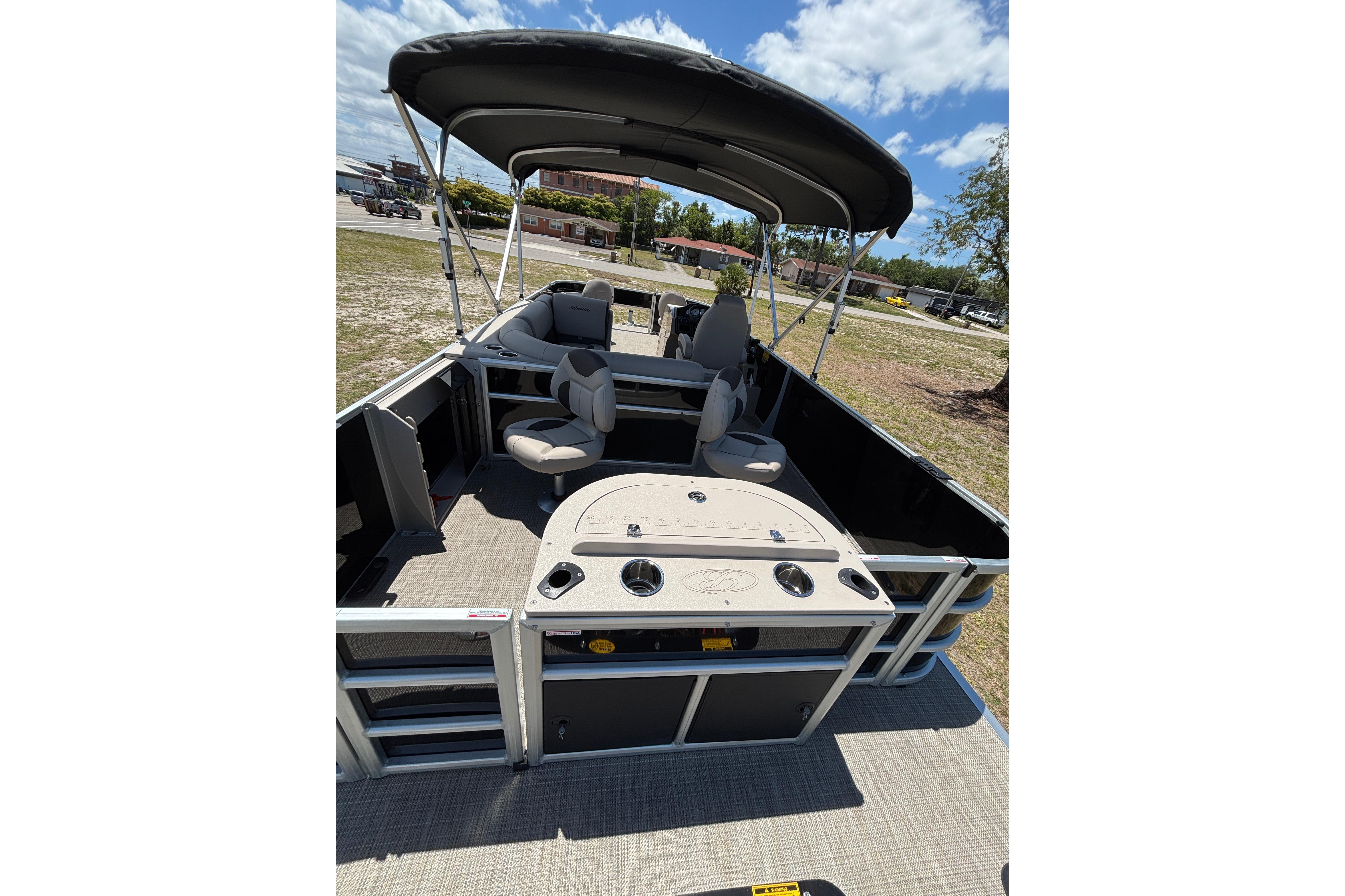 2026 Bentley Pontoons Fish 243 4-Point with canopy and seating area.