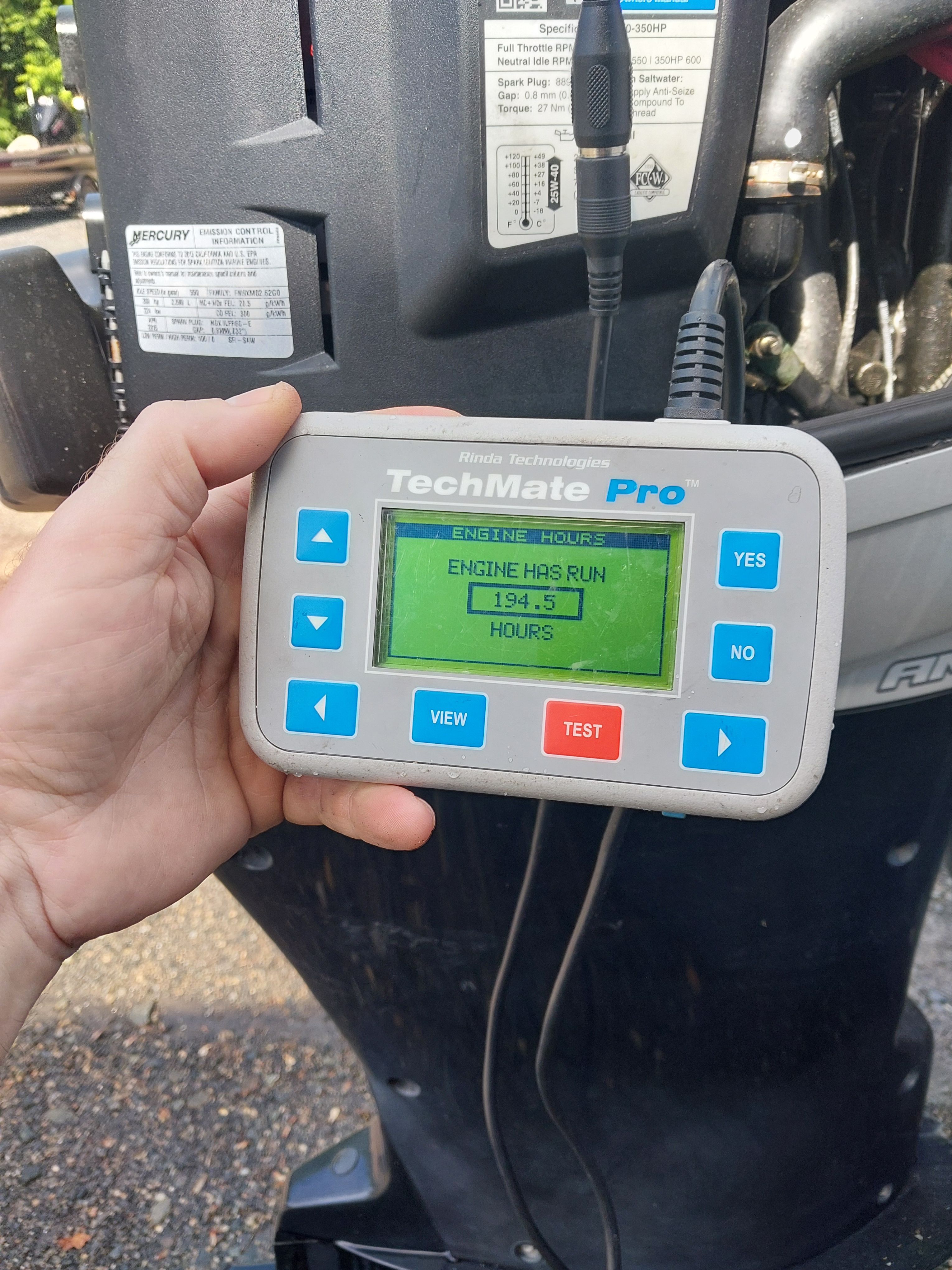 A TechMate Pro displays 134.5 engine hours on an outboard motor.