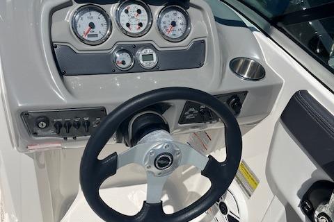 2015 Chaparral 21 H2O Sport dashboard with steering wheel and gauges.