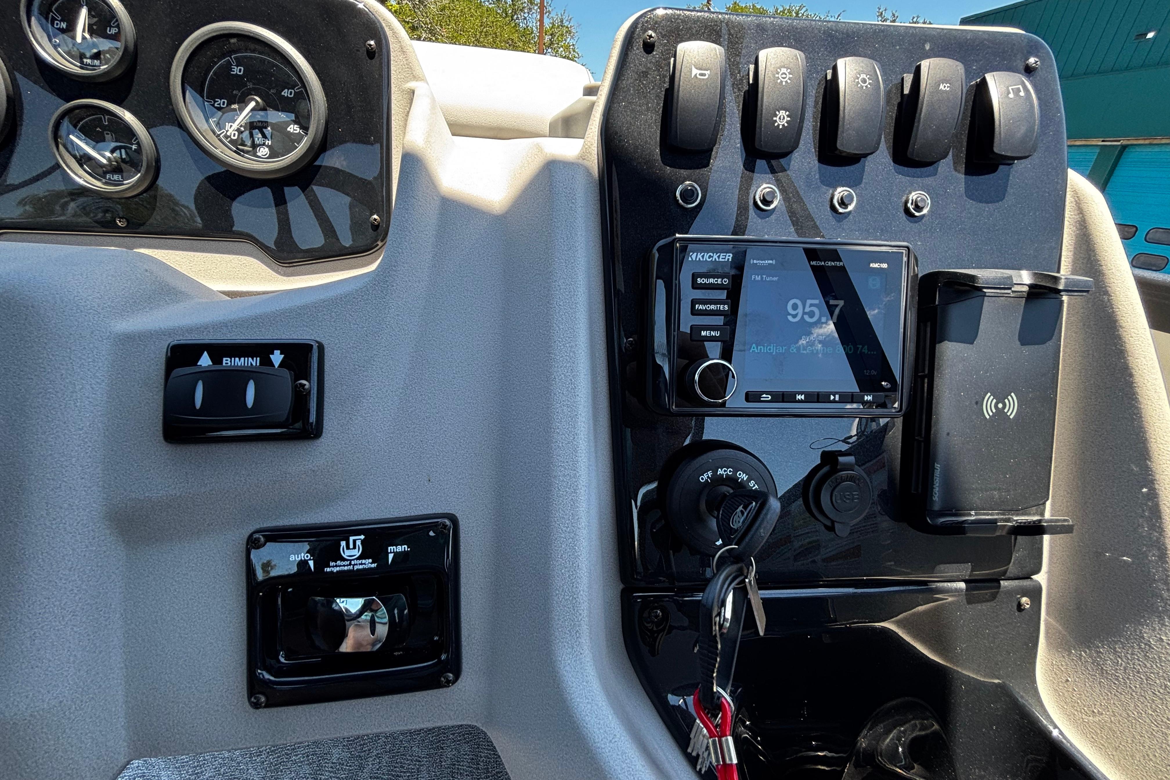 Dashboard of 2026 Princecraft Vectra 23 QL boat with controls and radio display.