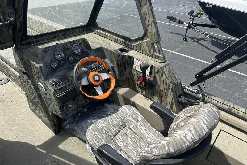 2026 SeaArk EasyCat boat interior with camouflage design and orange steering wheel.