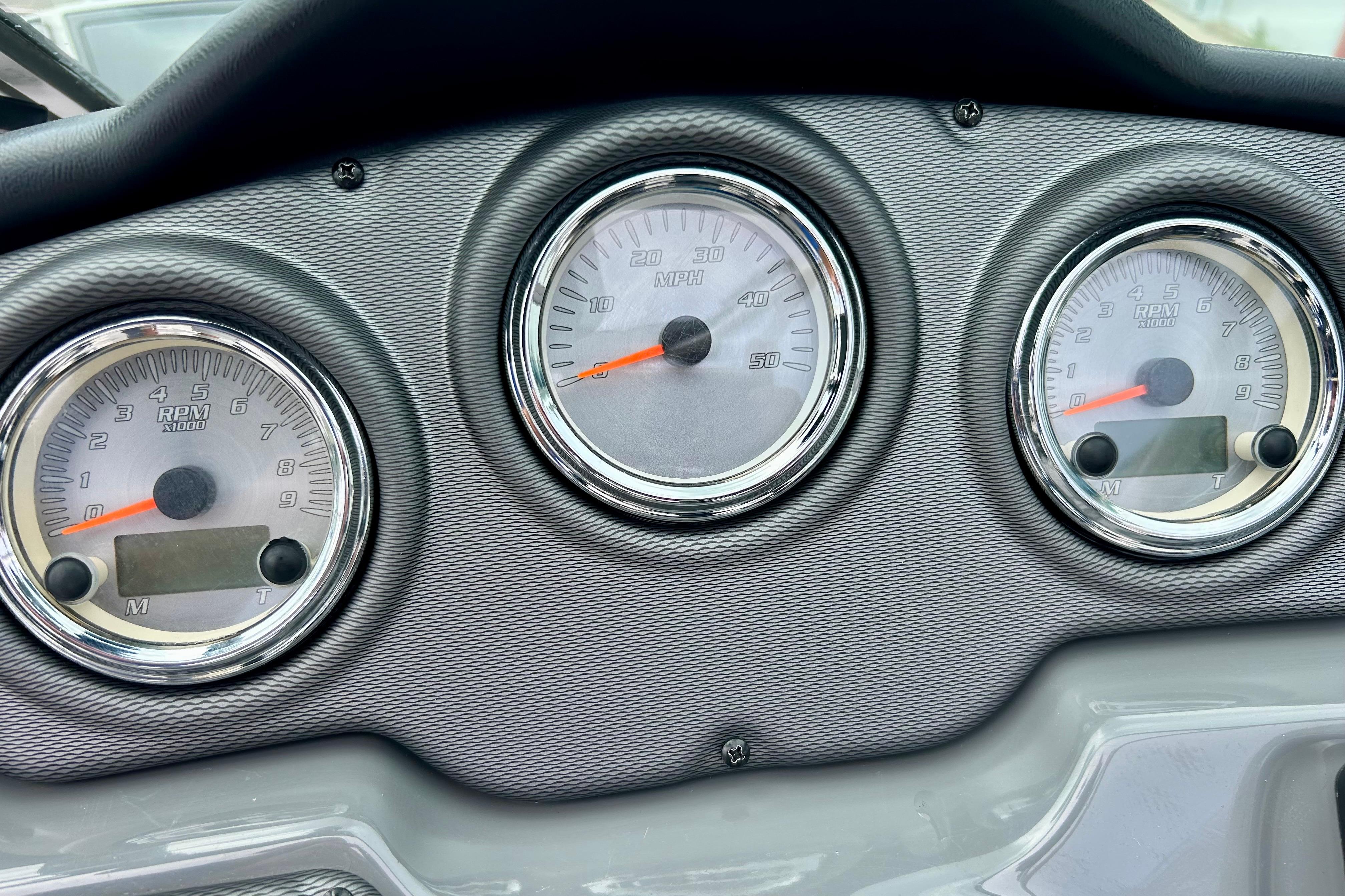 Dashboard of 2015 Yamaha Boats AR210 with RPM and speed gauges.