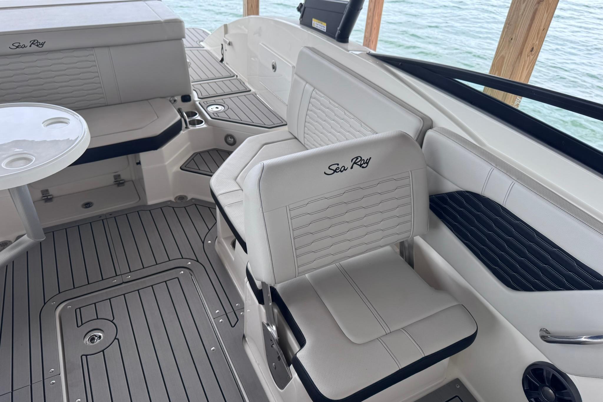 2021 Sea Ray SPX 230 boat interior with white seating and sleek design.